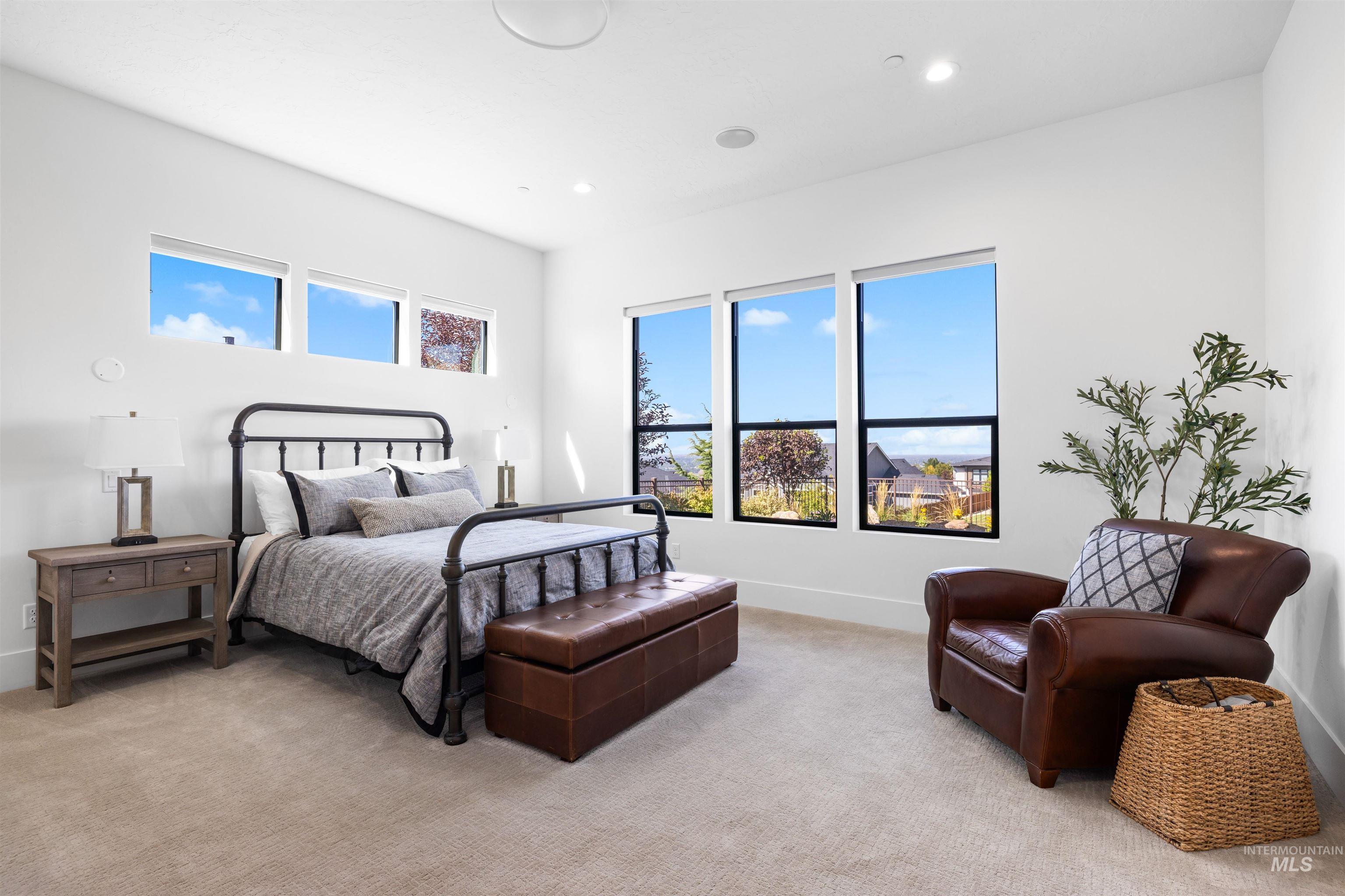 Bedroom featuring light colored carpet and recessed lighting