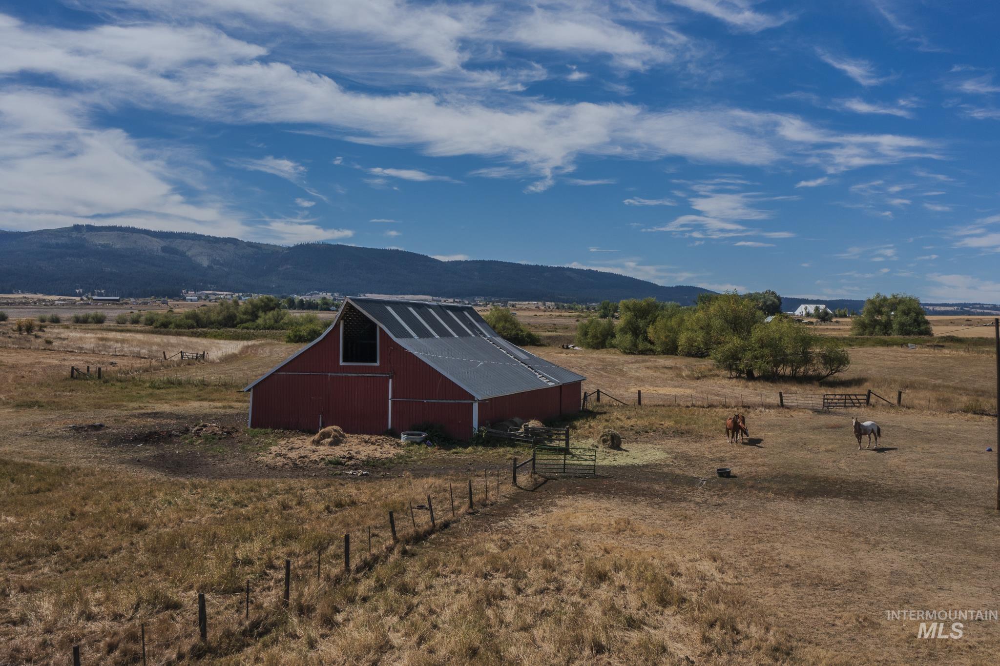 View of mountain backdrop with rural landscape