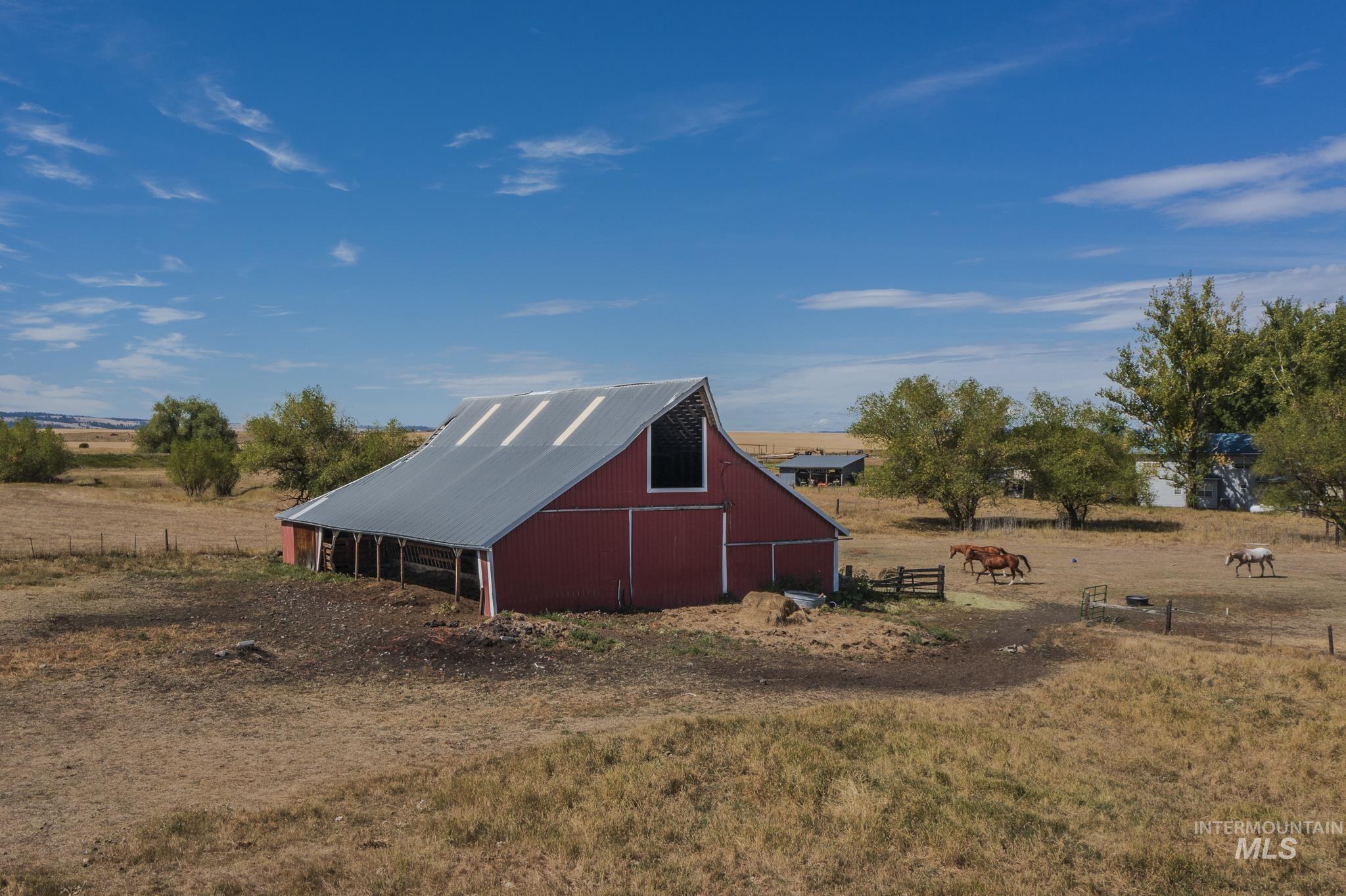 View of barn with a rural view