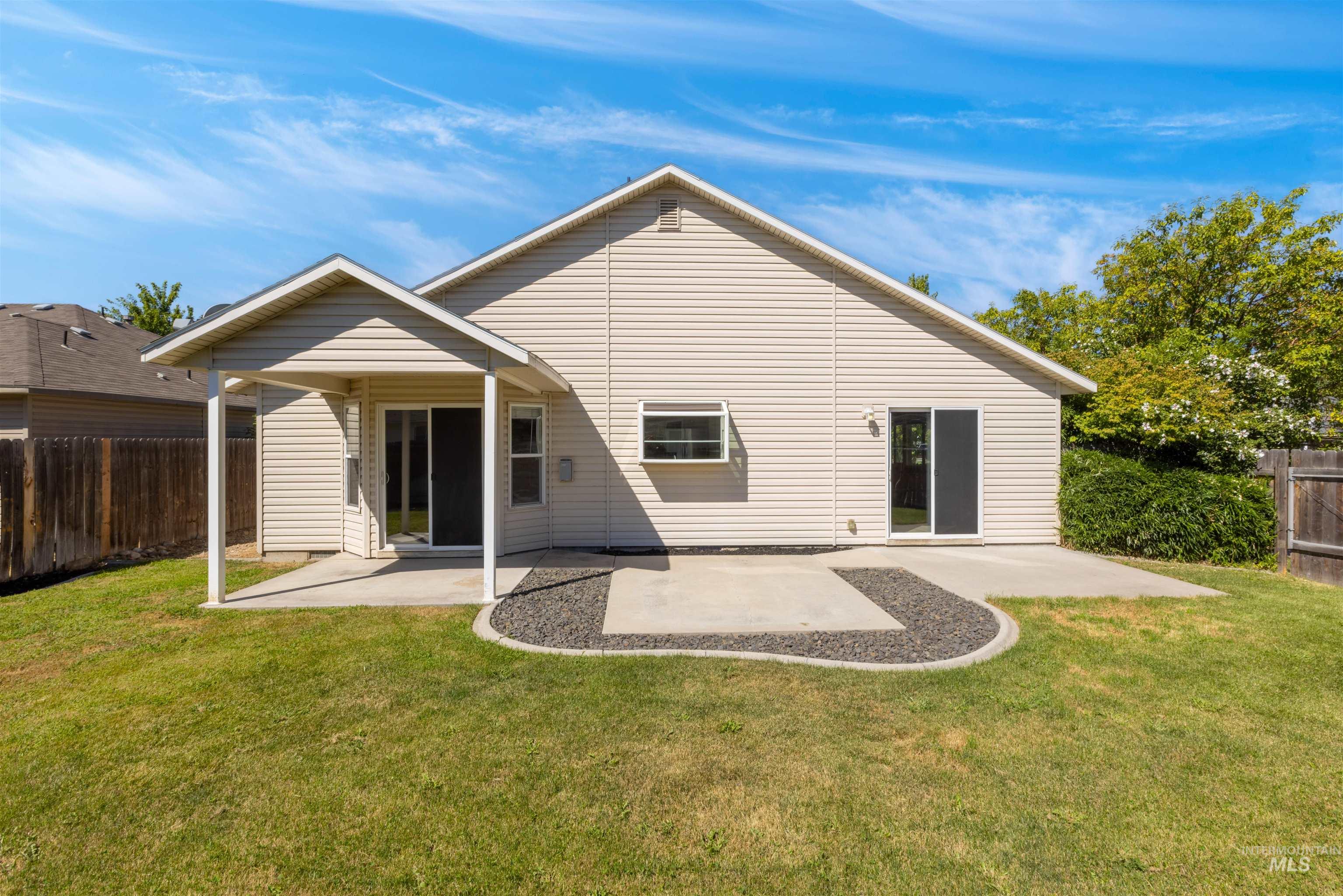 Rear view of house with a patio