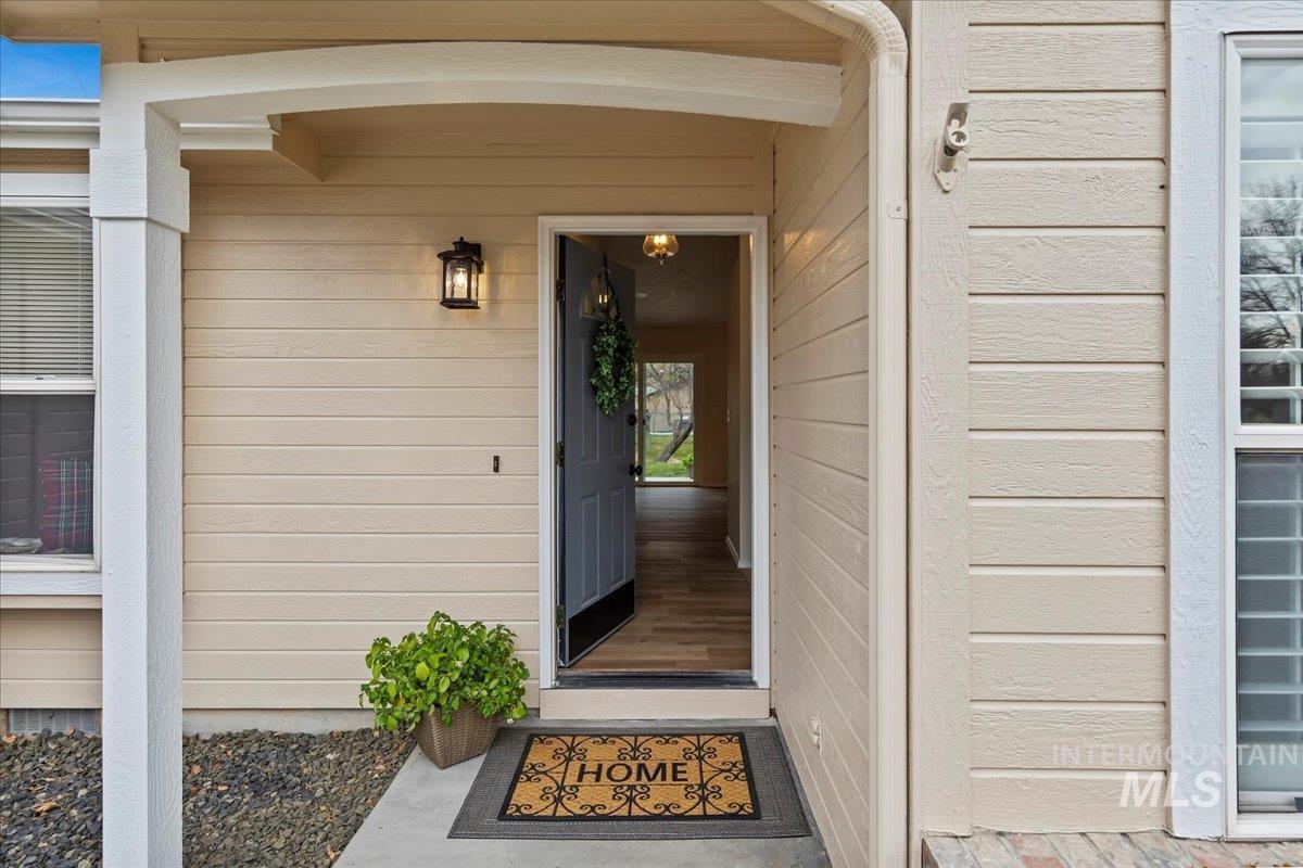 View of exterior entry.  All new Exterior Paint, Sept 2025!