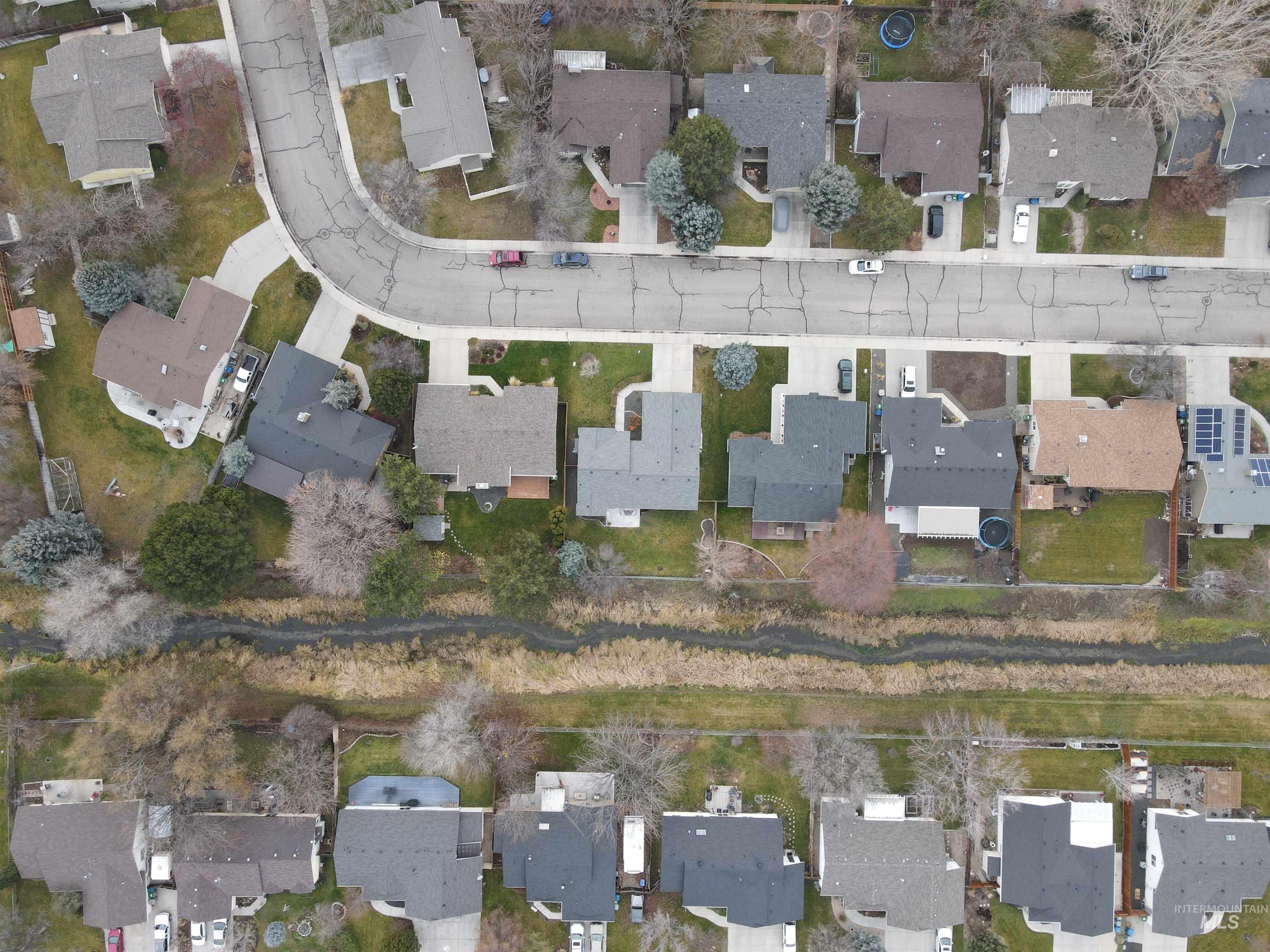 Aerial View of Home & nearby neighbors including the open space w/stream