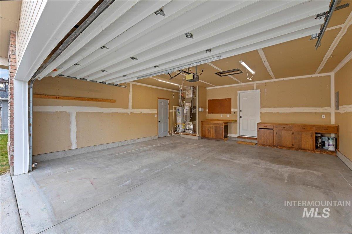 Garage featuring heating unit