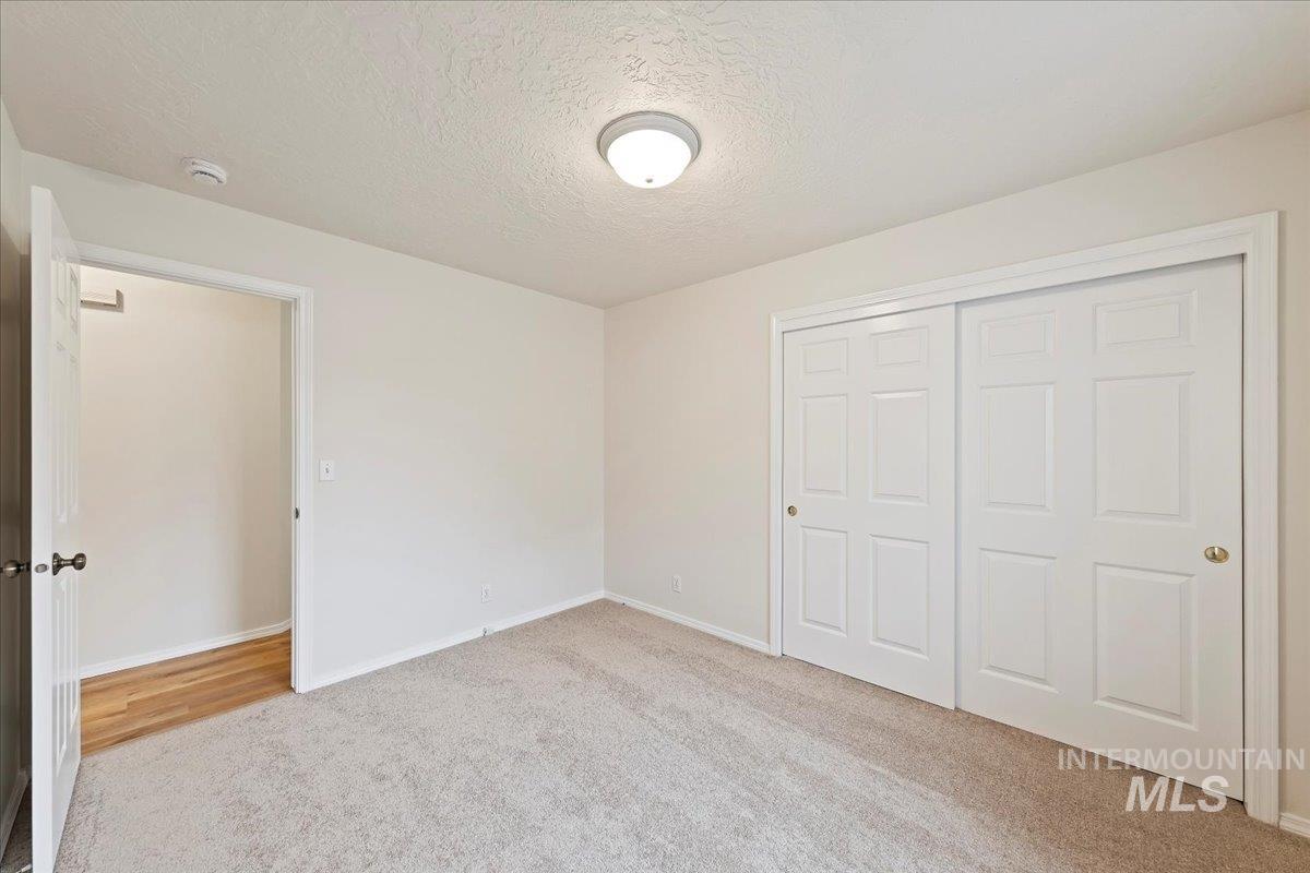 Bedroom #2 has a beautiful Spacious Closet with freshly painted closet doors!
