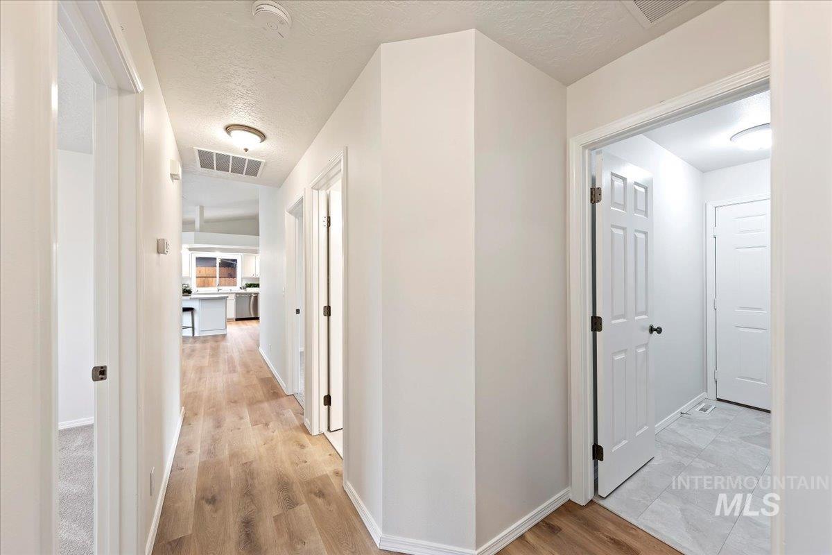 Hall featuring Luxury Vinyl Plank Flooring, New Smoke Detectors Throughout!