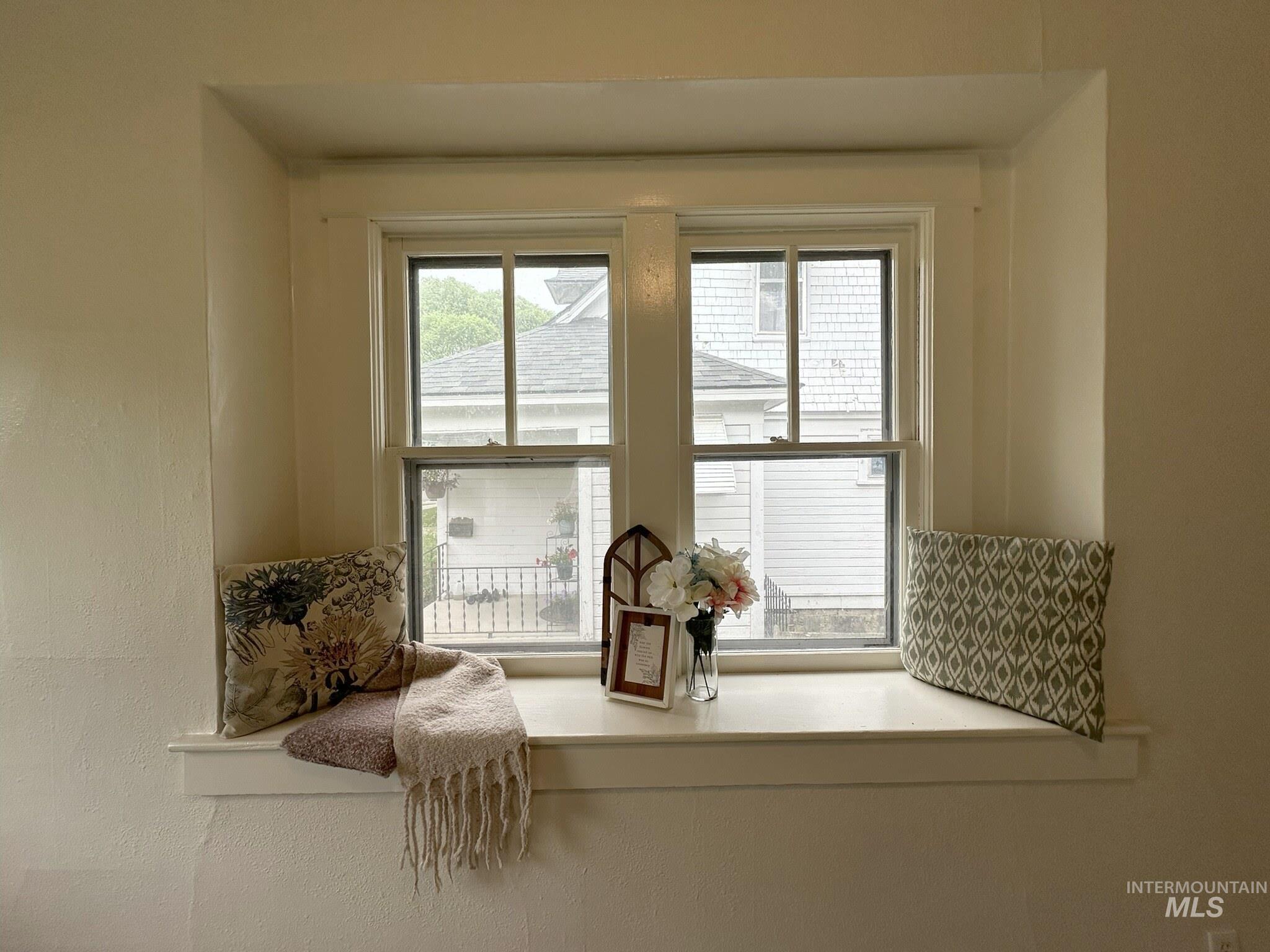 Recessed window alcove featuring two double-hung windows with white trim