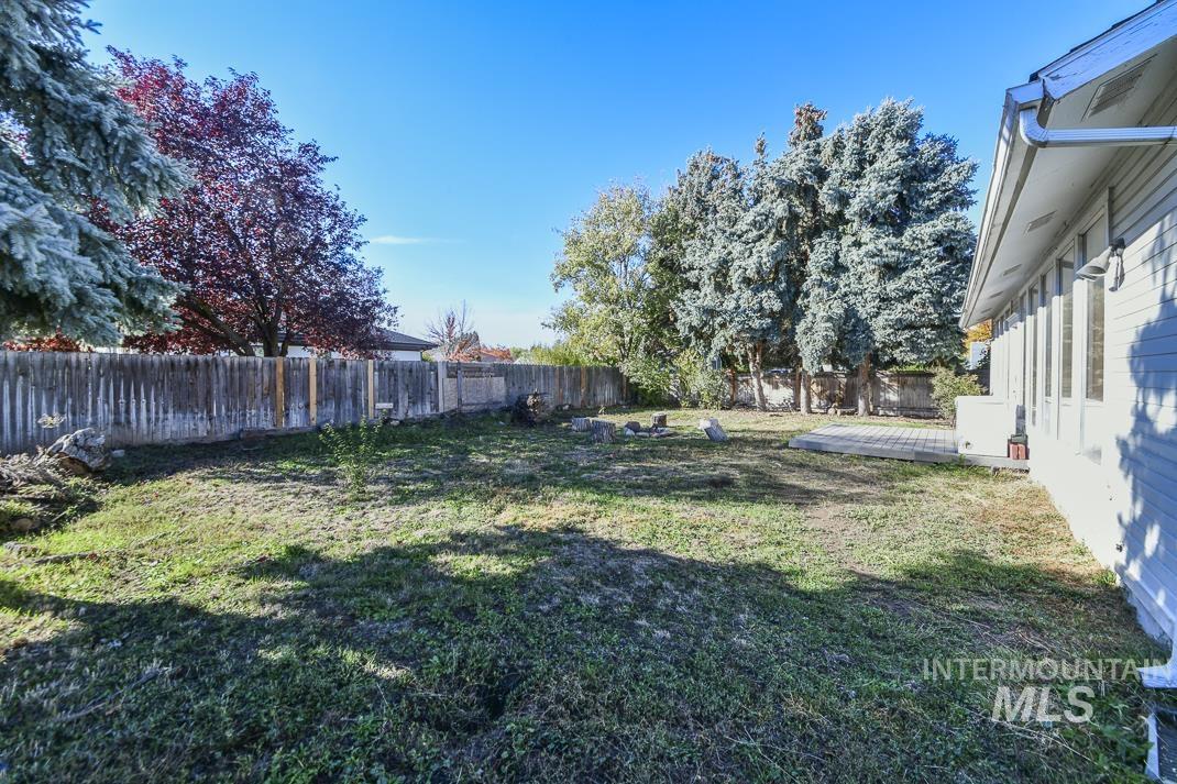 View of fenced backyard