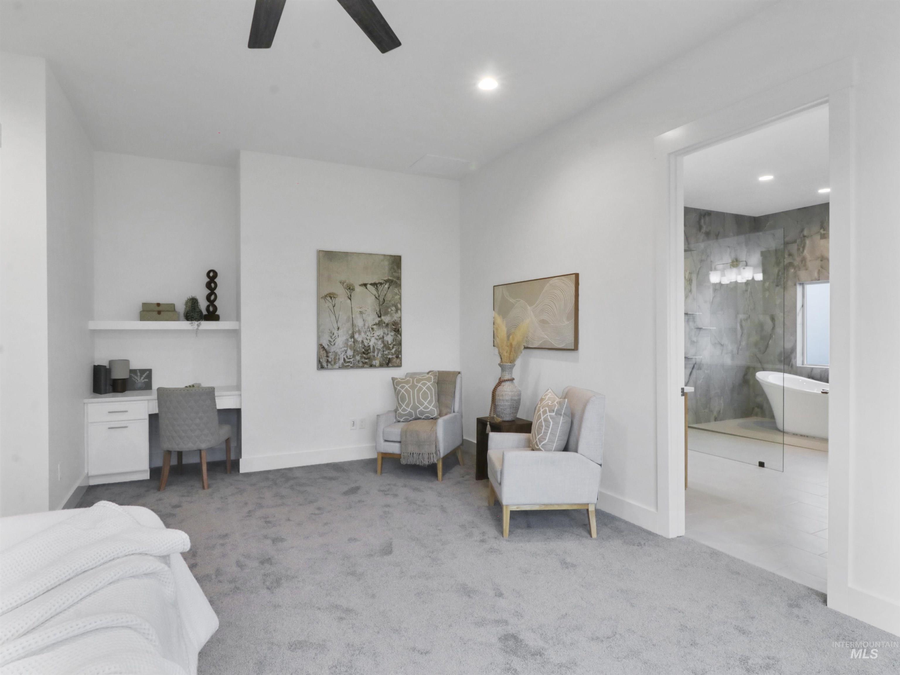 Carpeted bedroom featuring built in study area, a ceiling fan, and recessed lighting