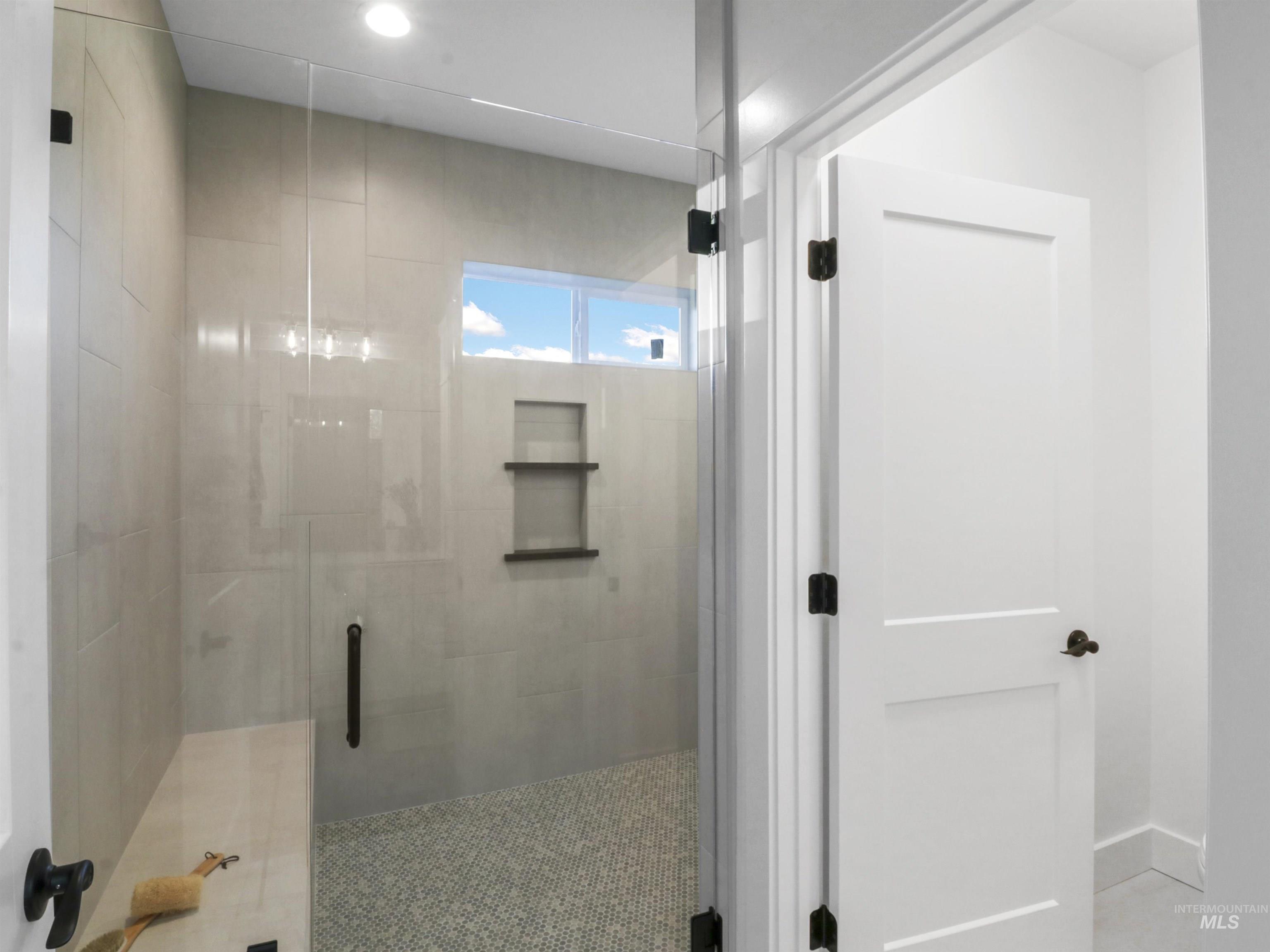 Full bathroom featuring a stall shower and recessed lighting
