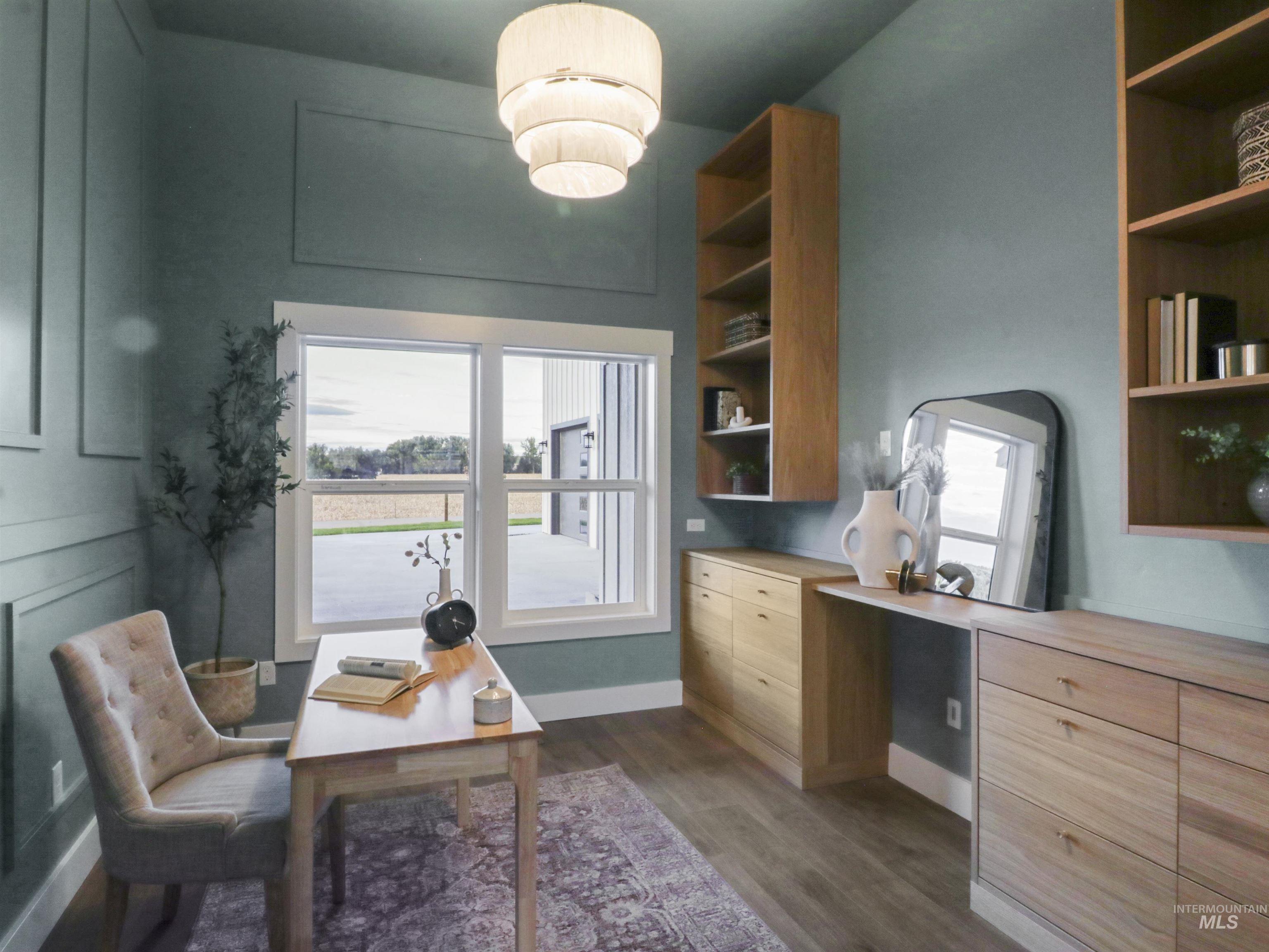 Office with dark wood-type flooring and baseboards