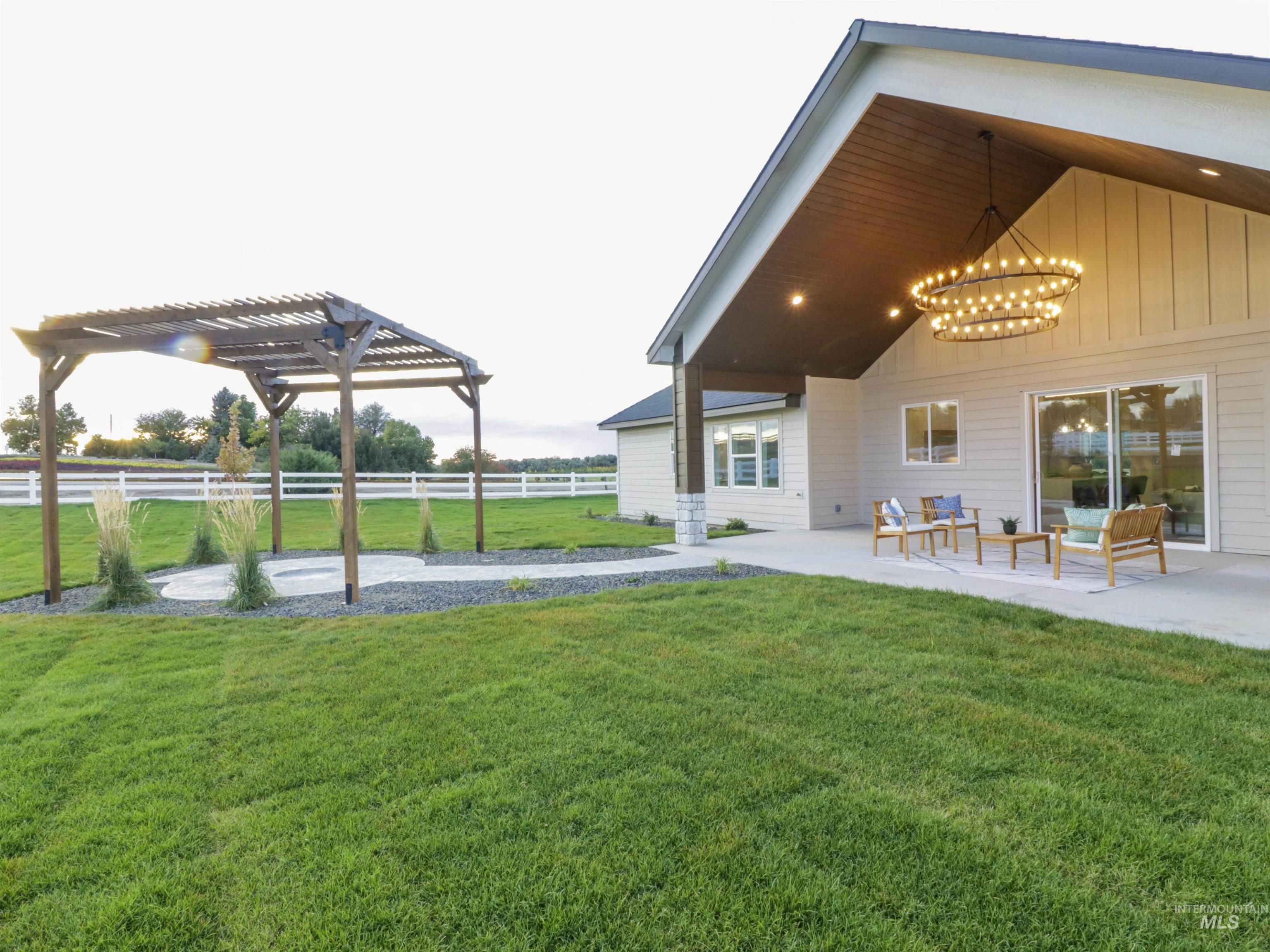 View of yard featuring a patio area and a pergola