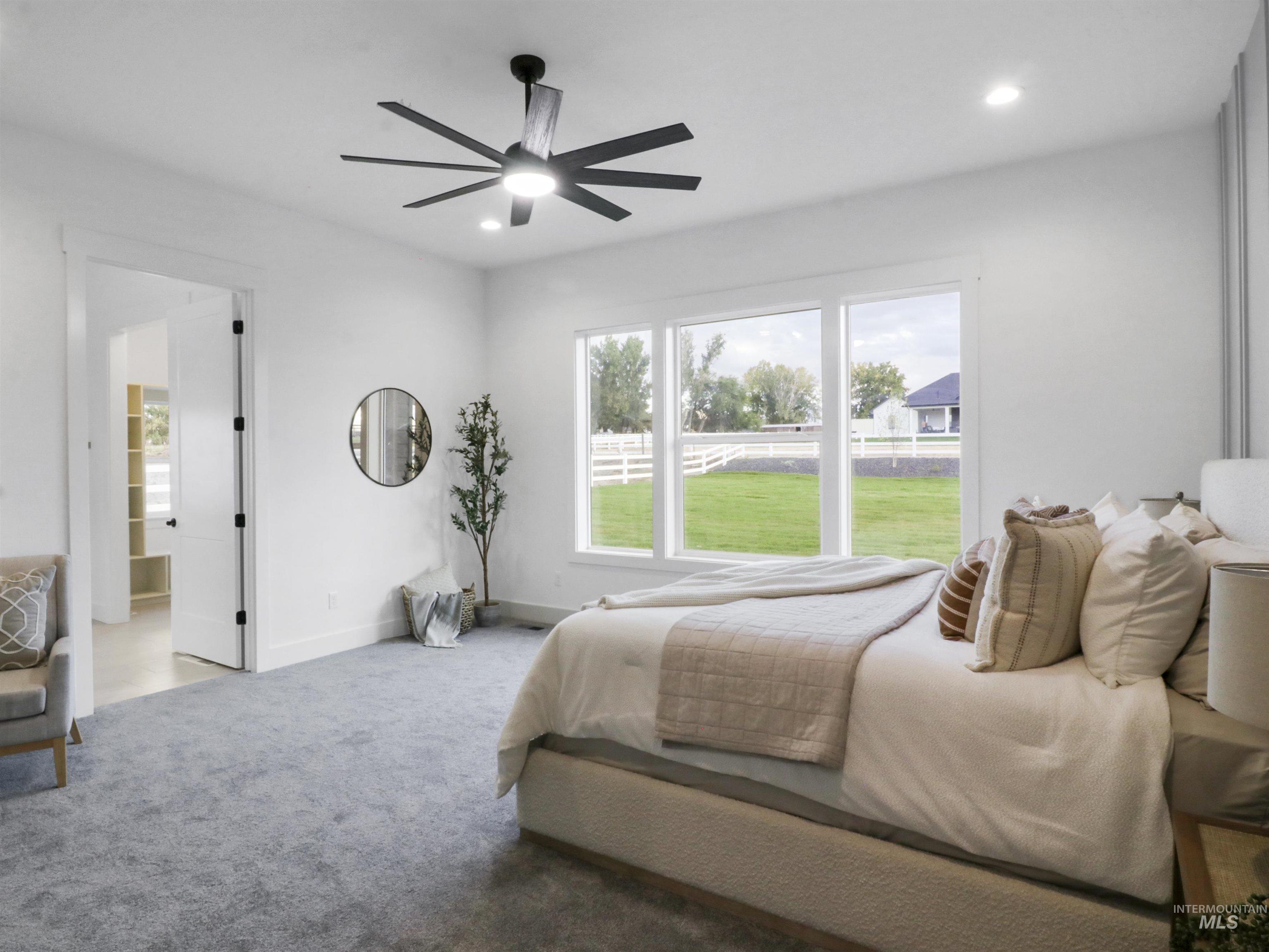 Bedroom featuring carpet, ceiling fan, and recessed lighting