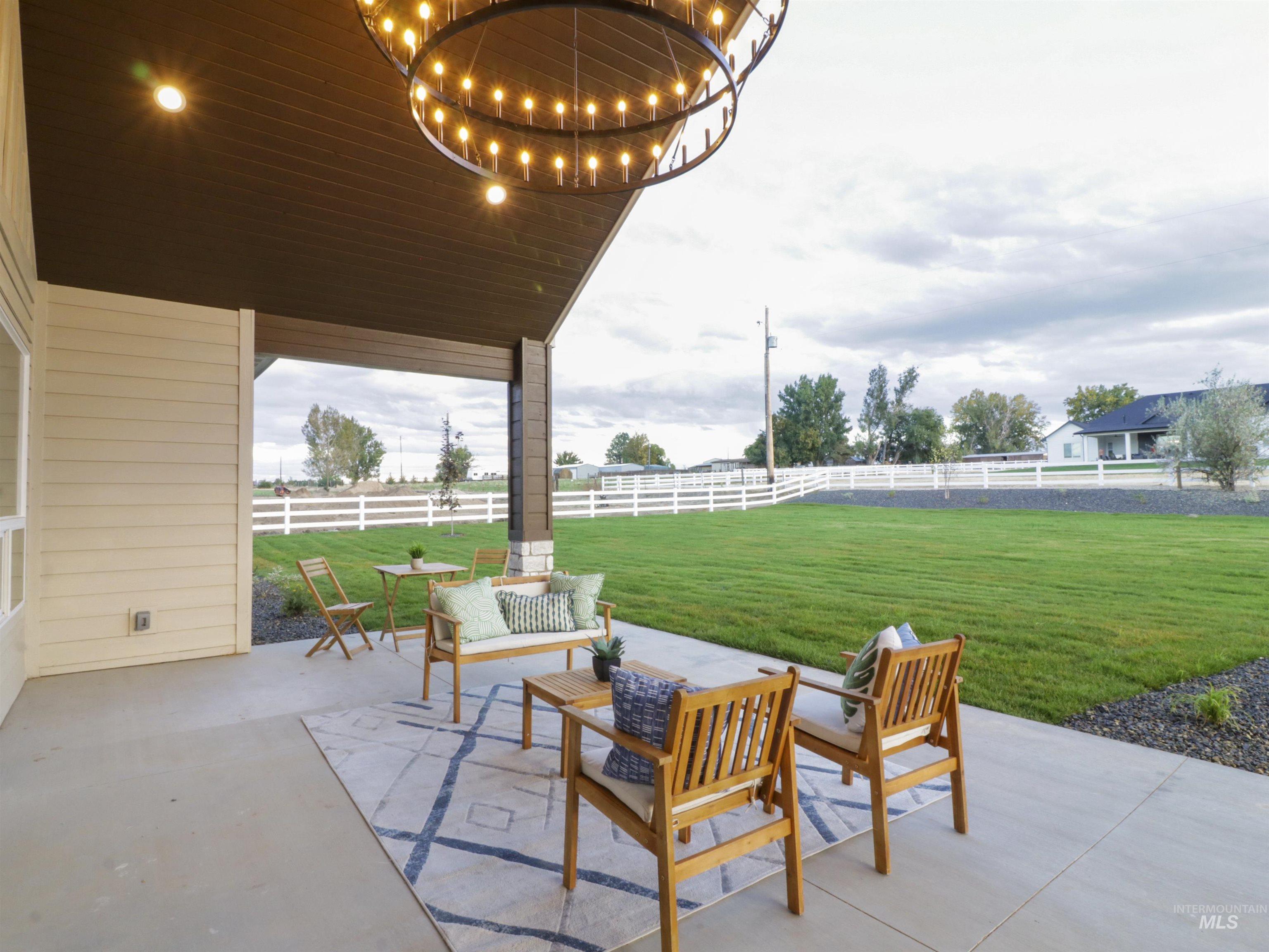 Fenced backyard with a patio area and an outdoor hangout area