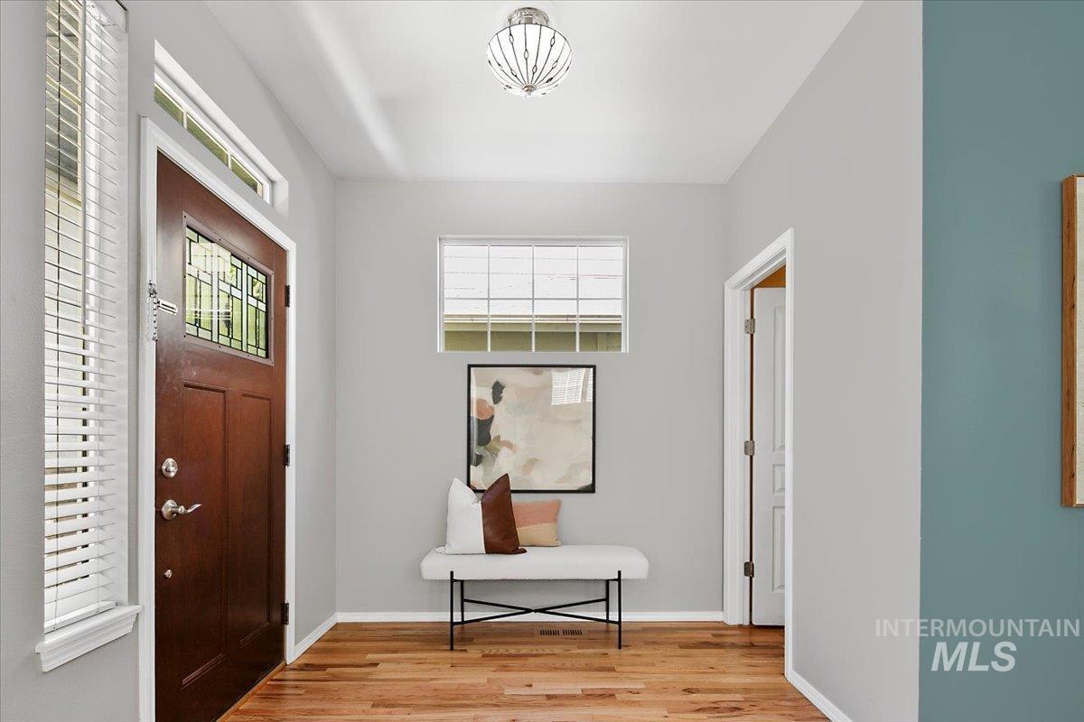Foyer entrance featuring healthy amount of natural light and light wood-type flooring