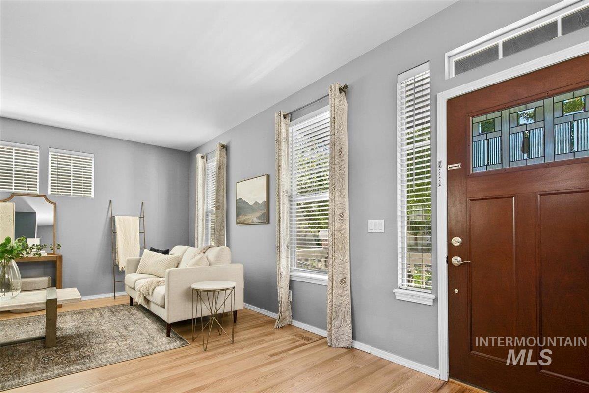 Foyer featuring light wood finished floors and plenty of natural light