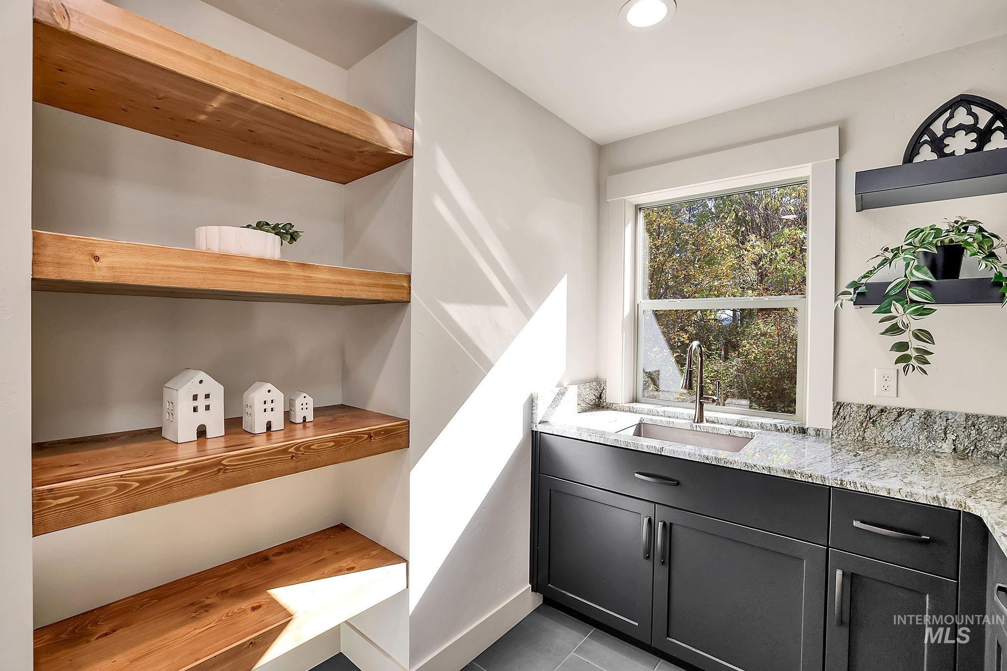 Pantry featuring a sink