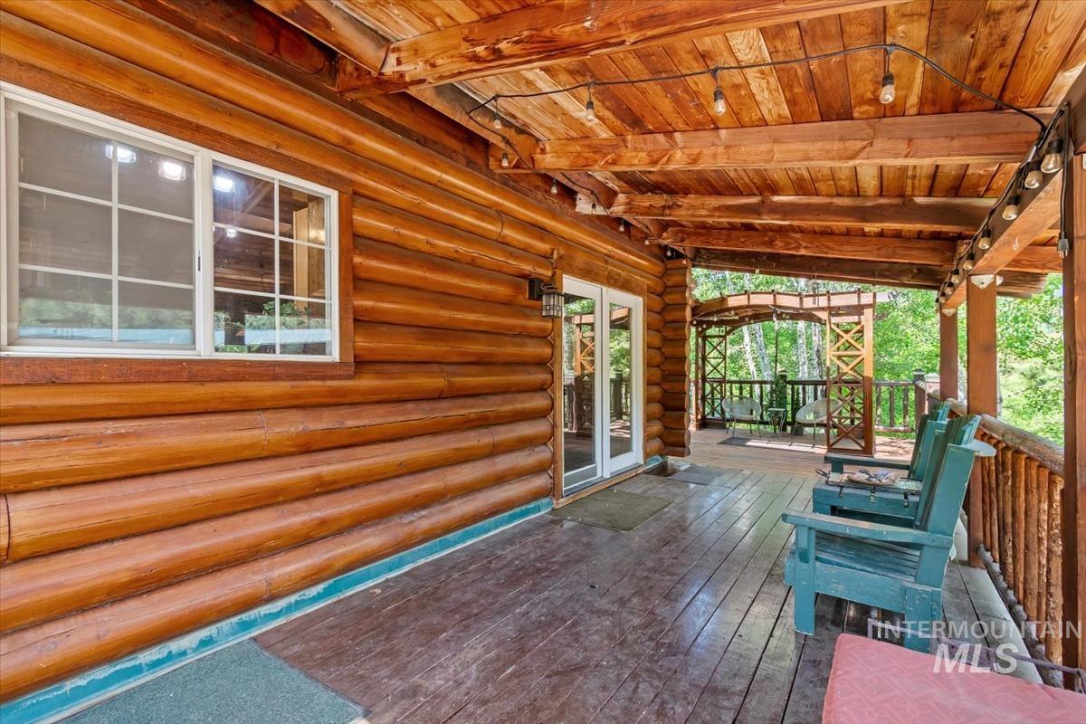 Wooden terrace featuring french doors
