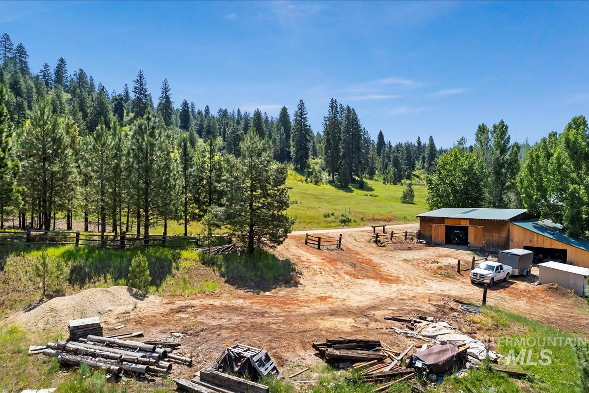 View of yard with an outbuilding and a pole building