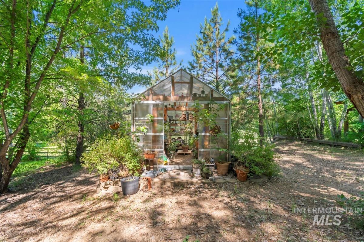 View of greenhouse with a sunroom