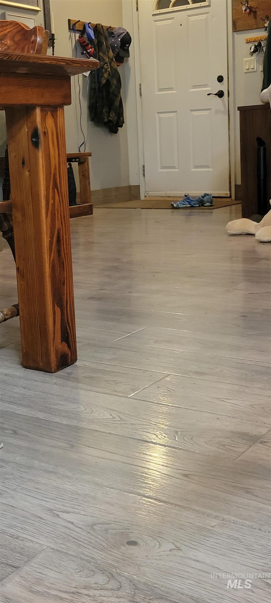 Detailed view of wood finished floors and baseboards