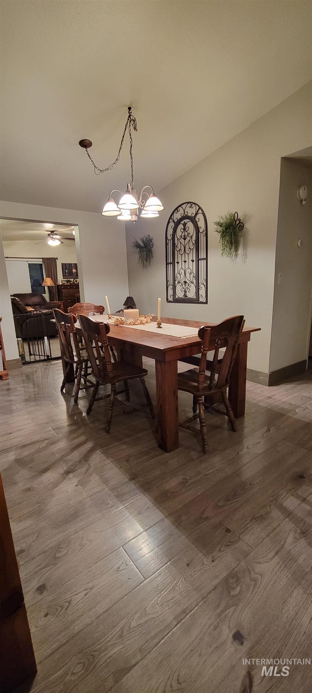 Dining room with light wood finished floors and baseboards