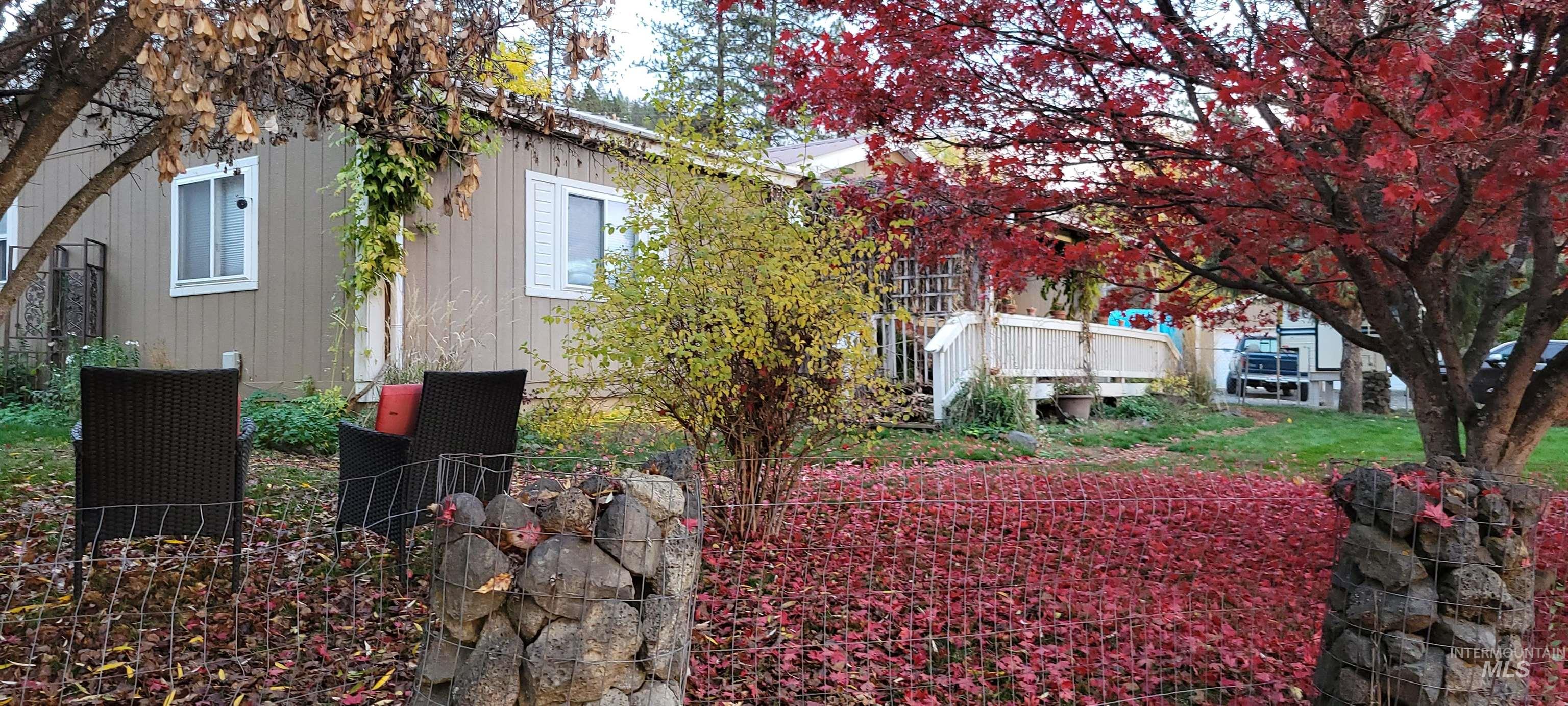 View of side of home featuring a deck
