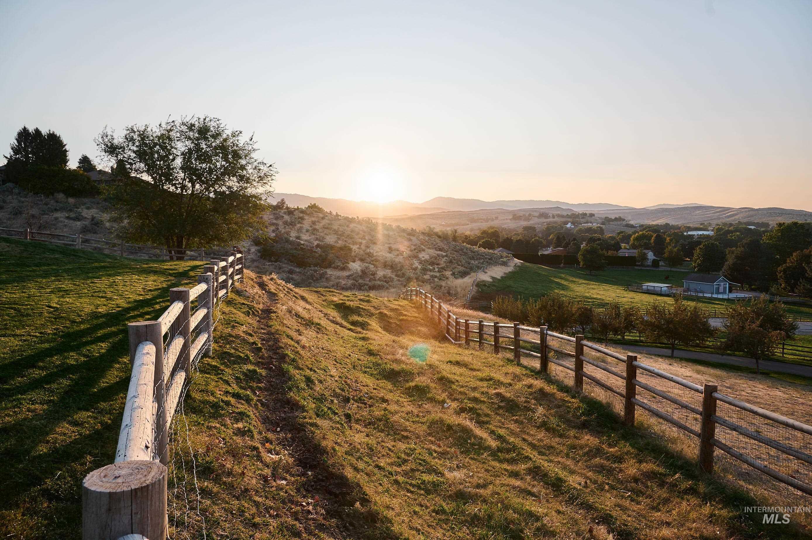 View of road with a rural view and a mountain view