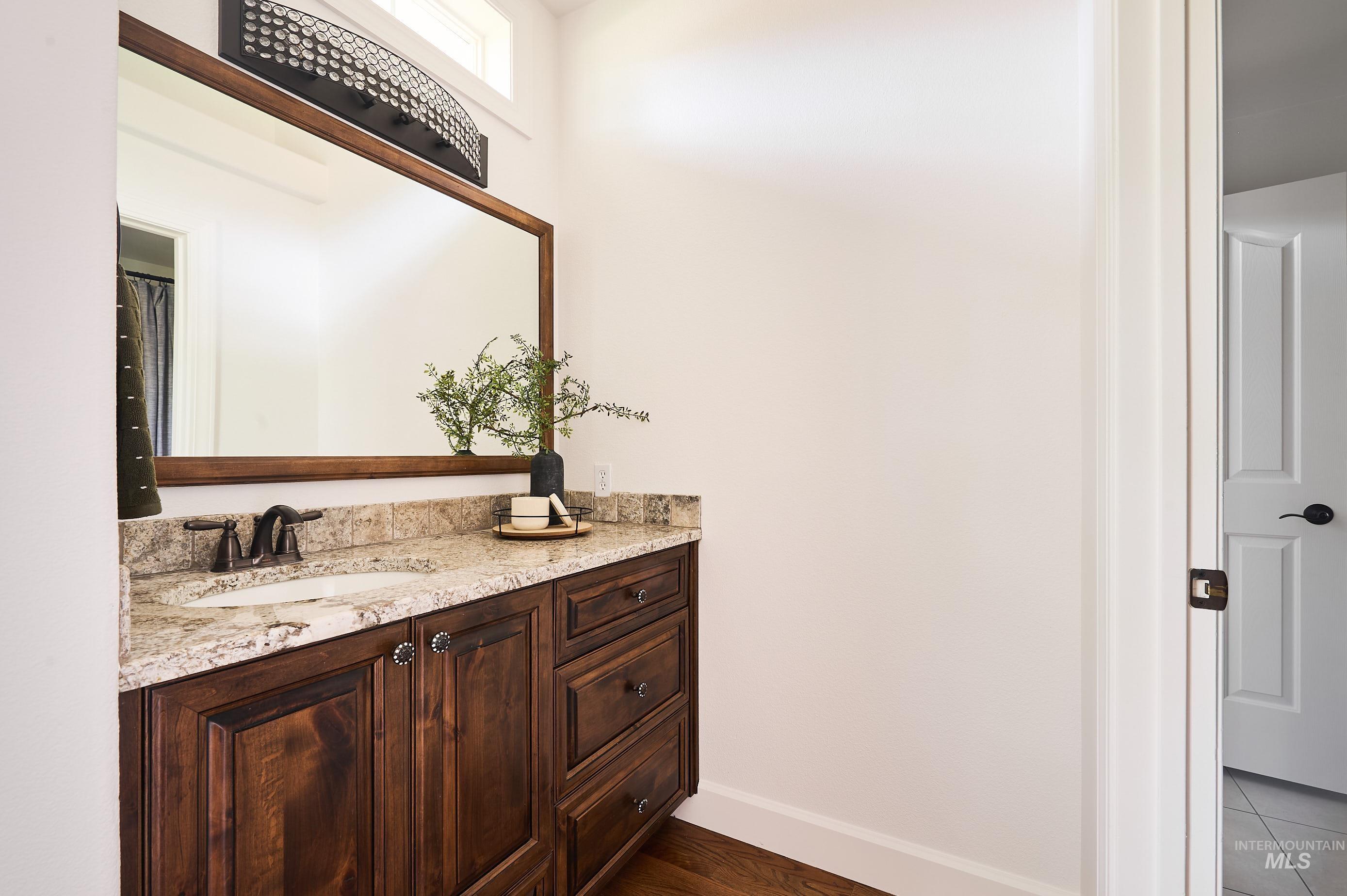 Bathroom with vanity and baseboards