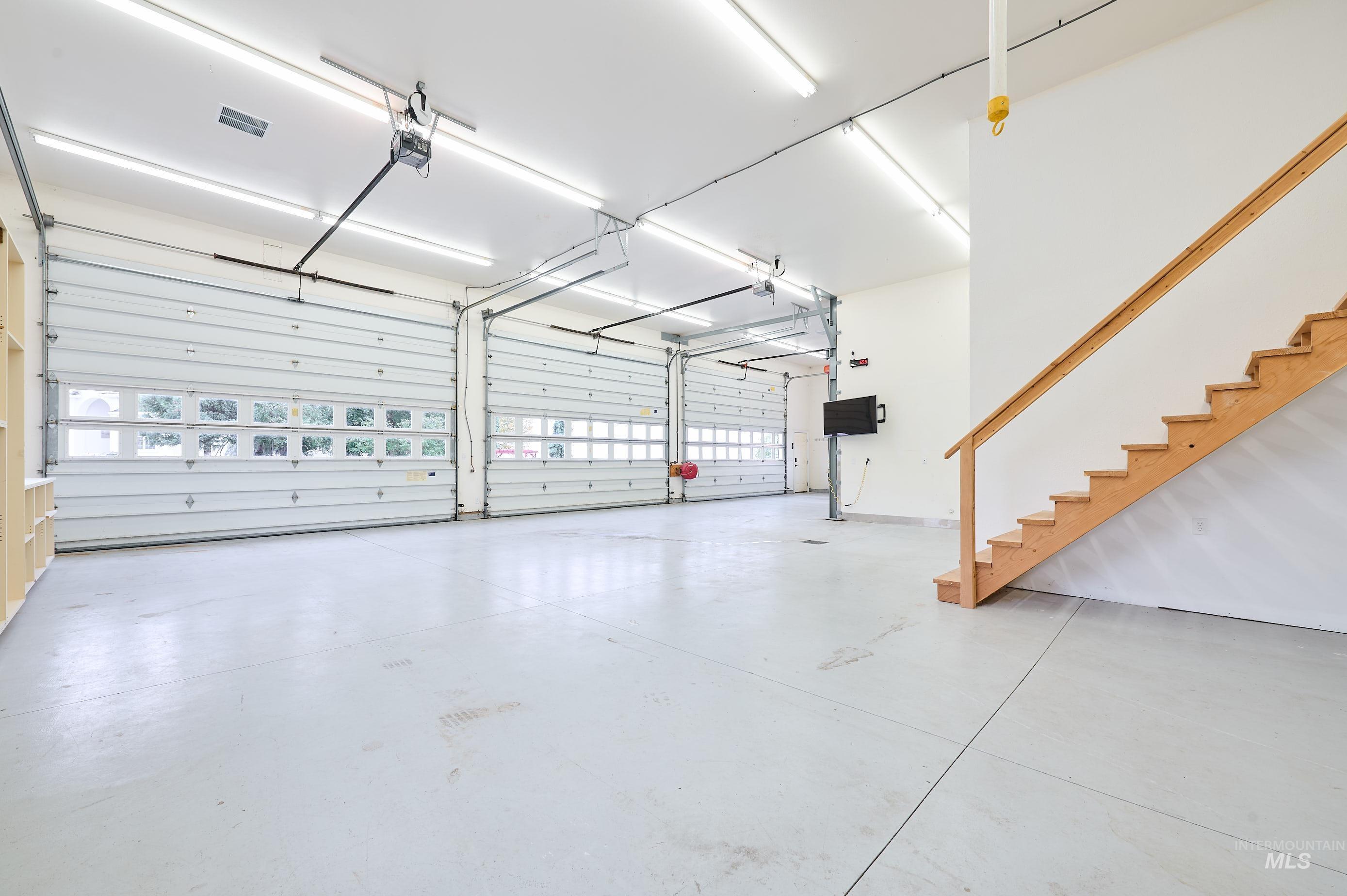 Garage featuring a garage door opener