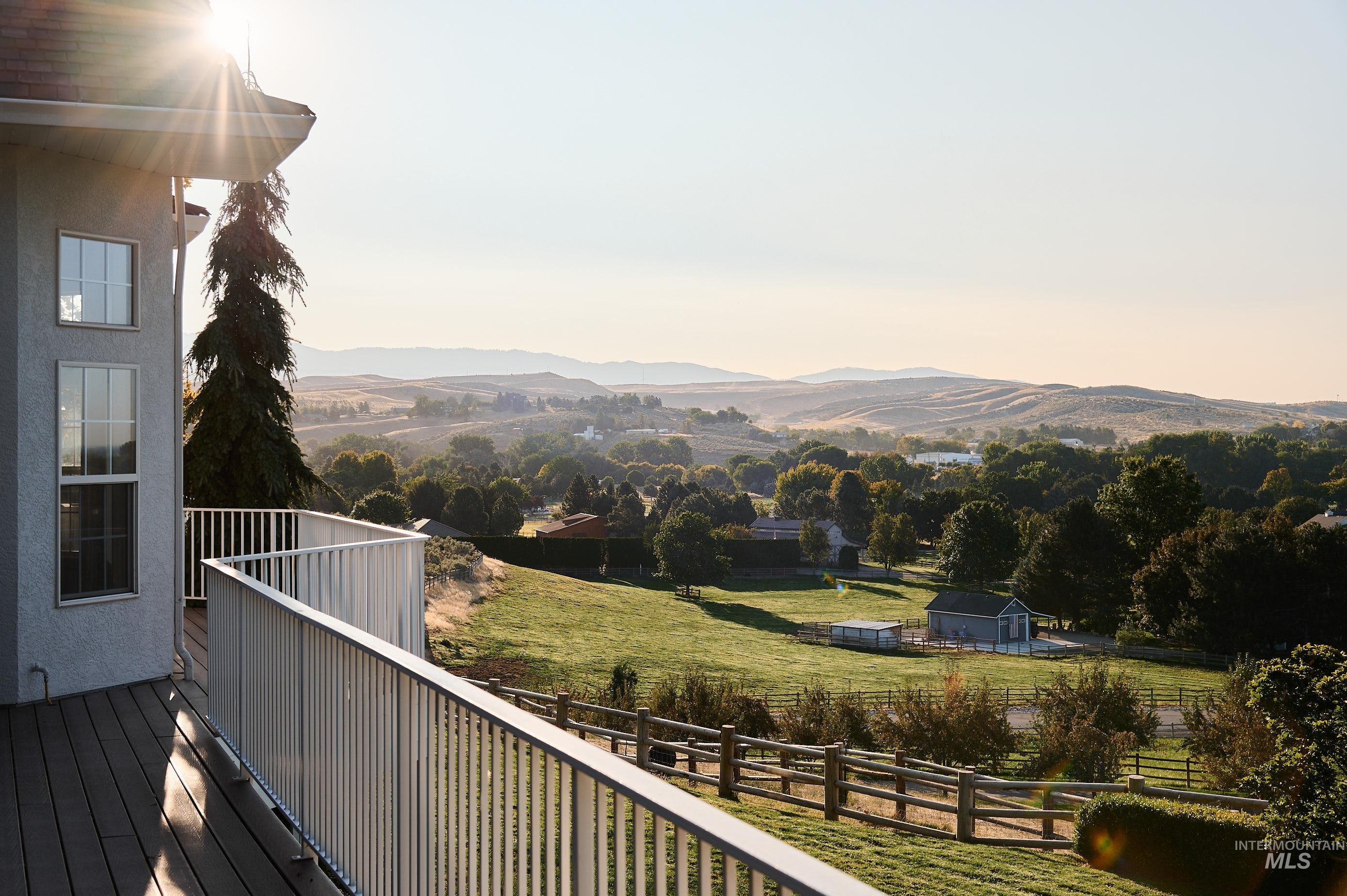 View of mountain backdrop featuring a tree filled landscape