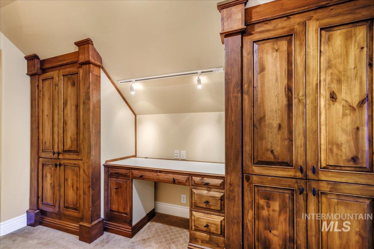 Bathroom with rail lighting and baseboards