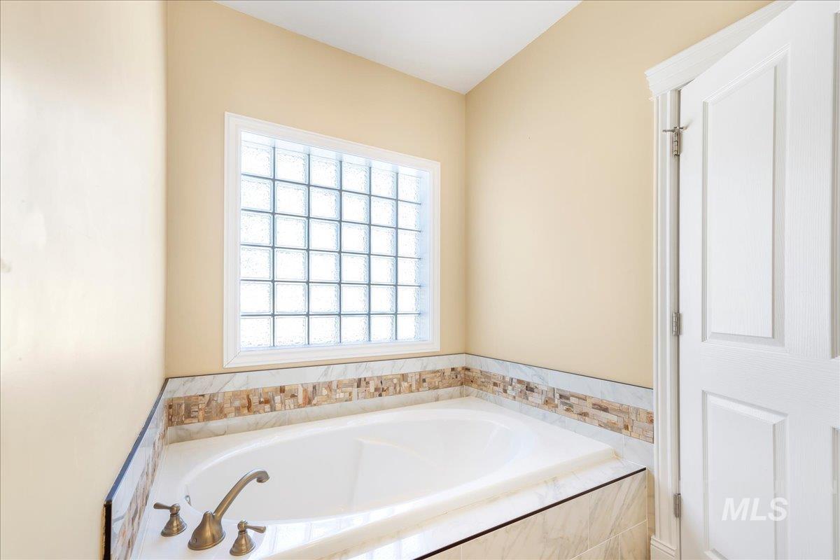 Full bathroom with a bath