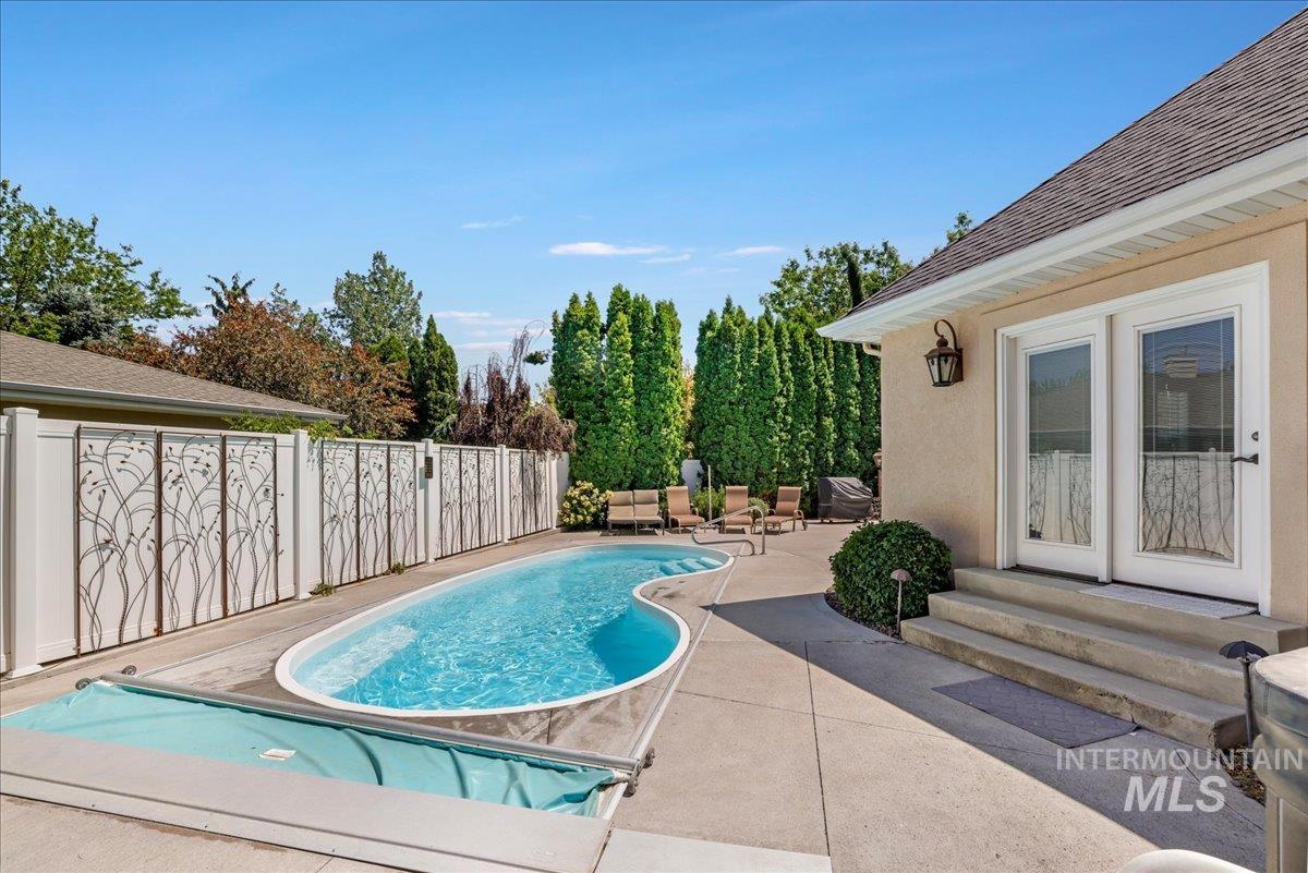 View of swimming pool with a patio