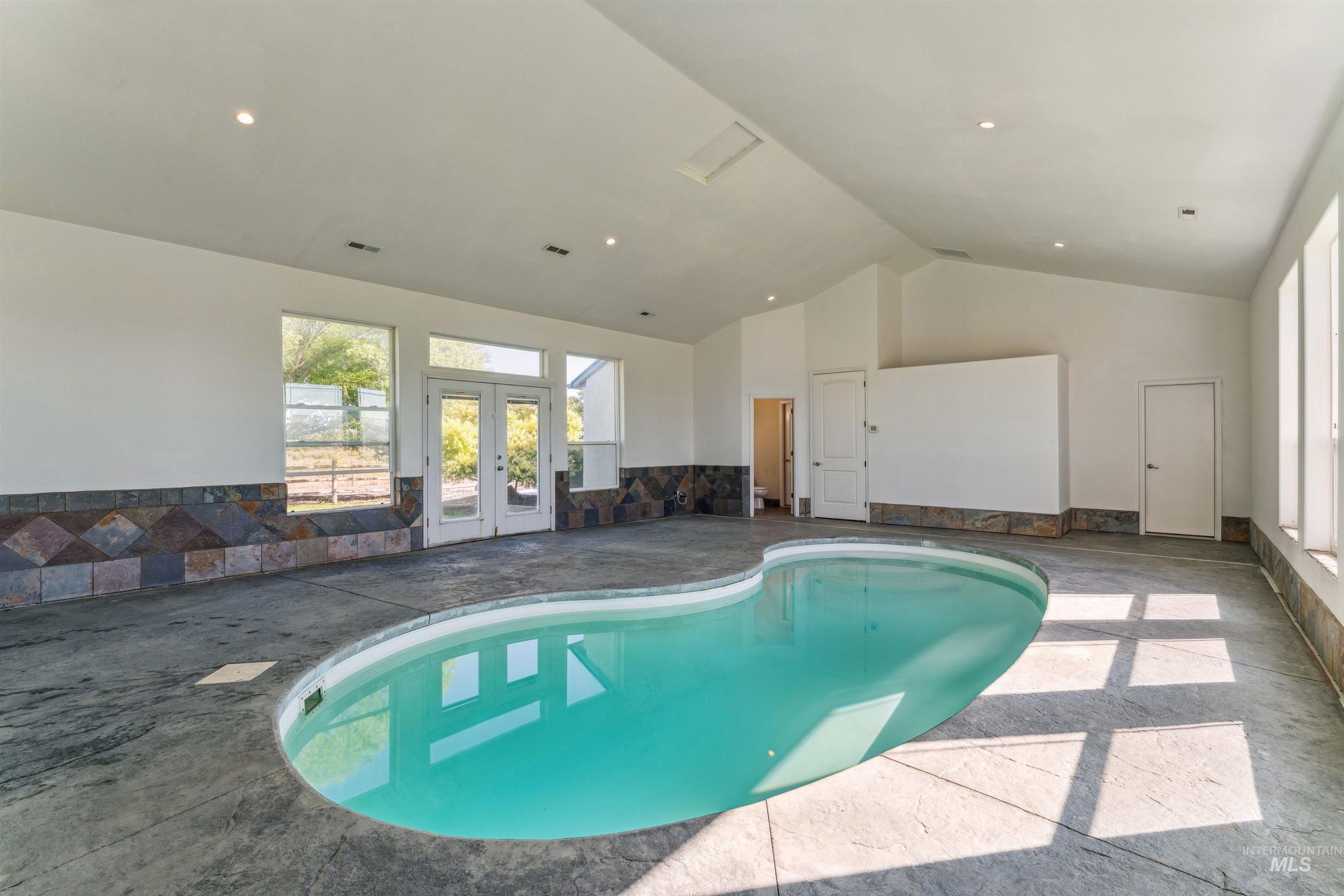 Indoor pool with french doors