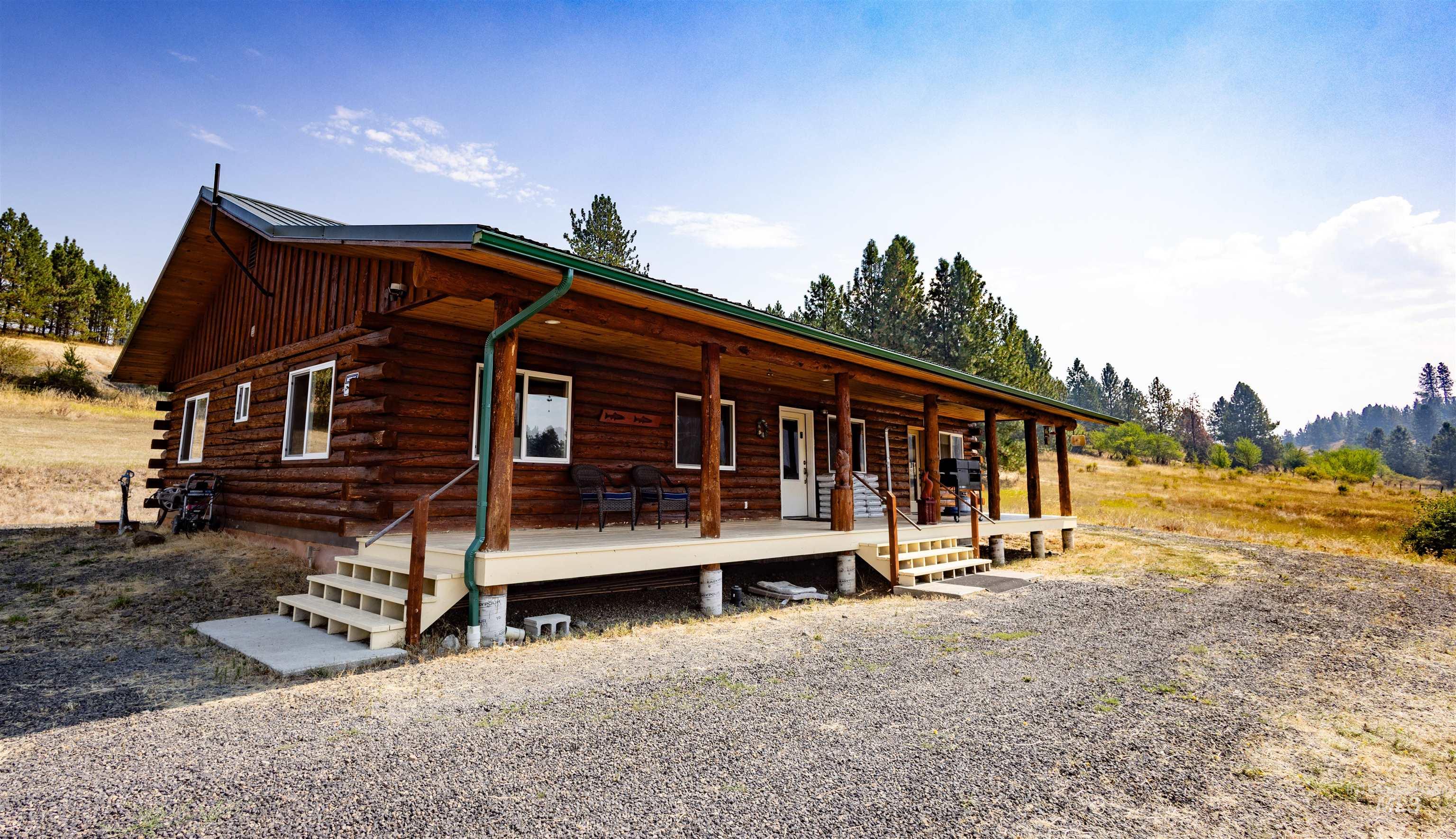 Cabin featuring a porch and log exterior