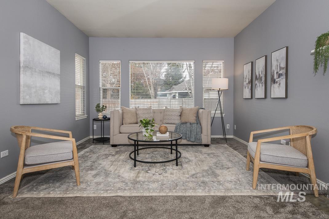 Sitting room featuring carpet floors