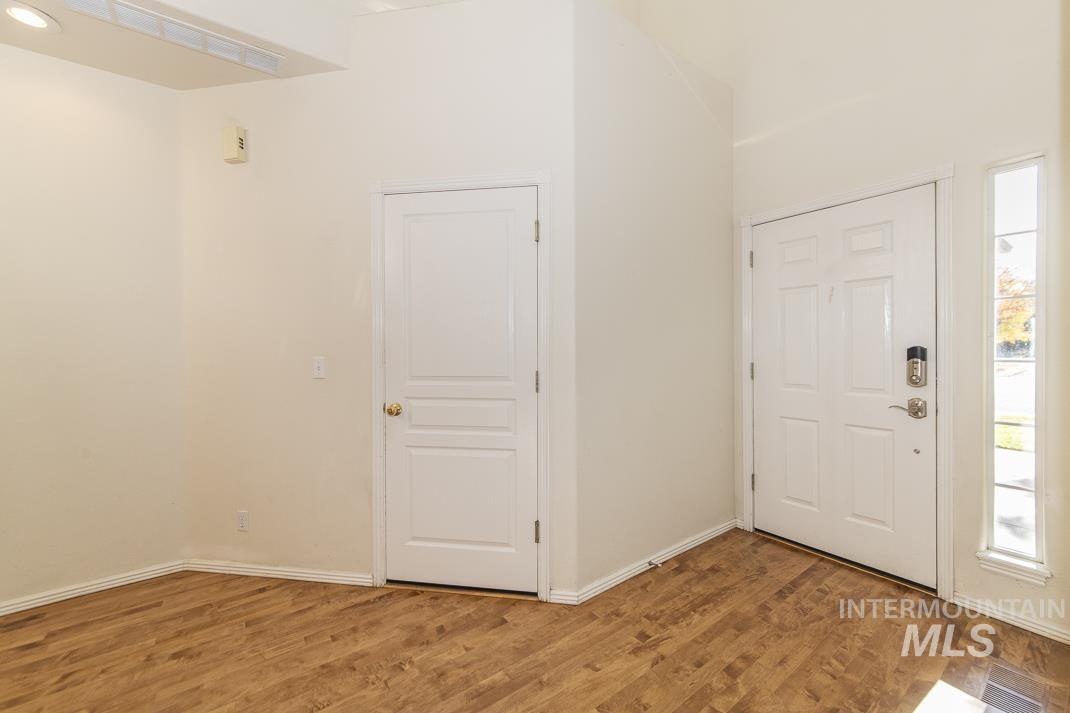 Foyer entrance featuring wood finished floors