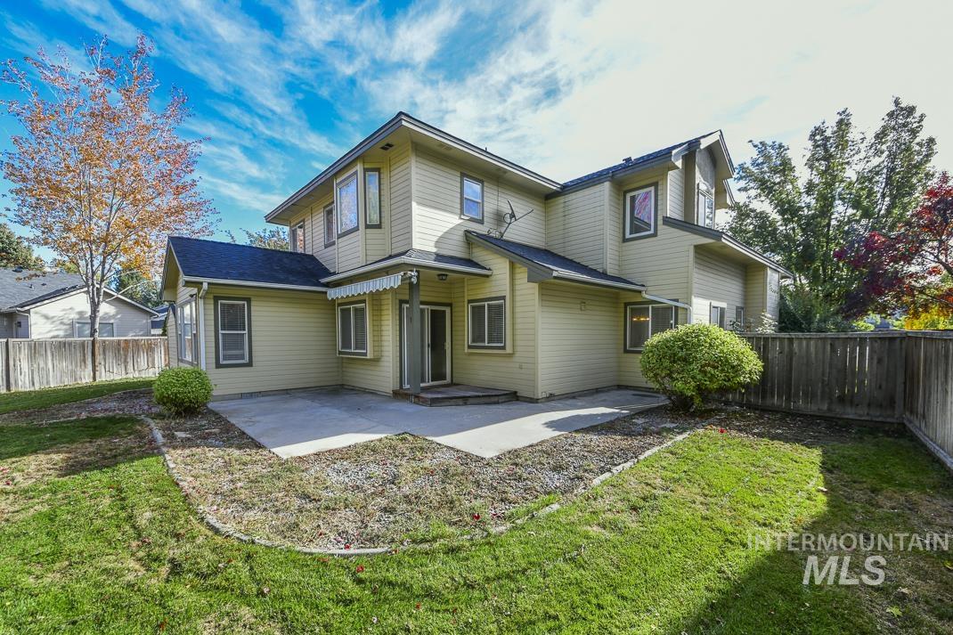 Back of property featuring a patio area, a fenced backyard, and a shingled roof