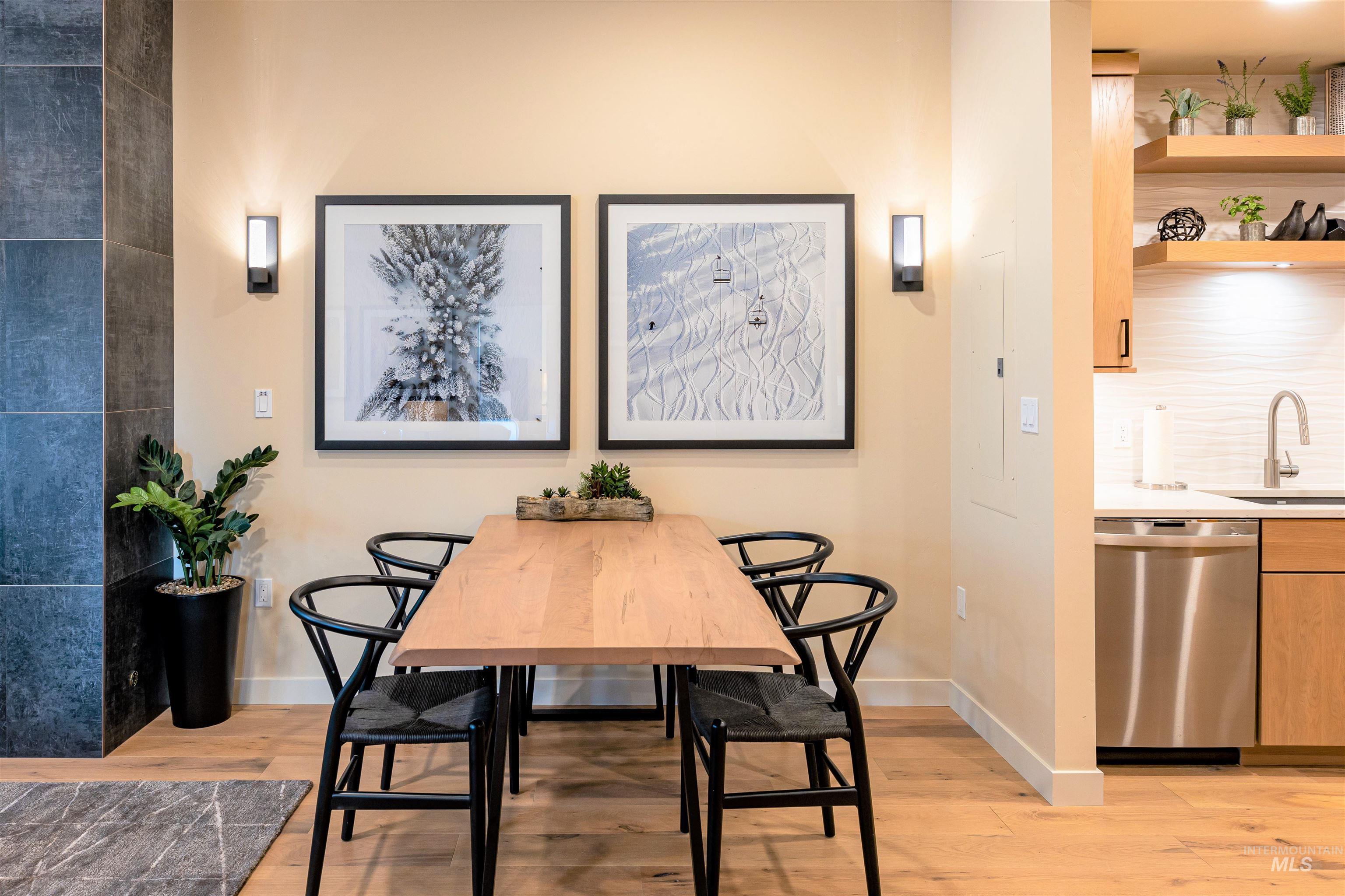 Dining space with light wood finished floors and baseboards