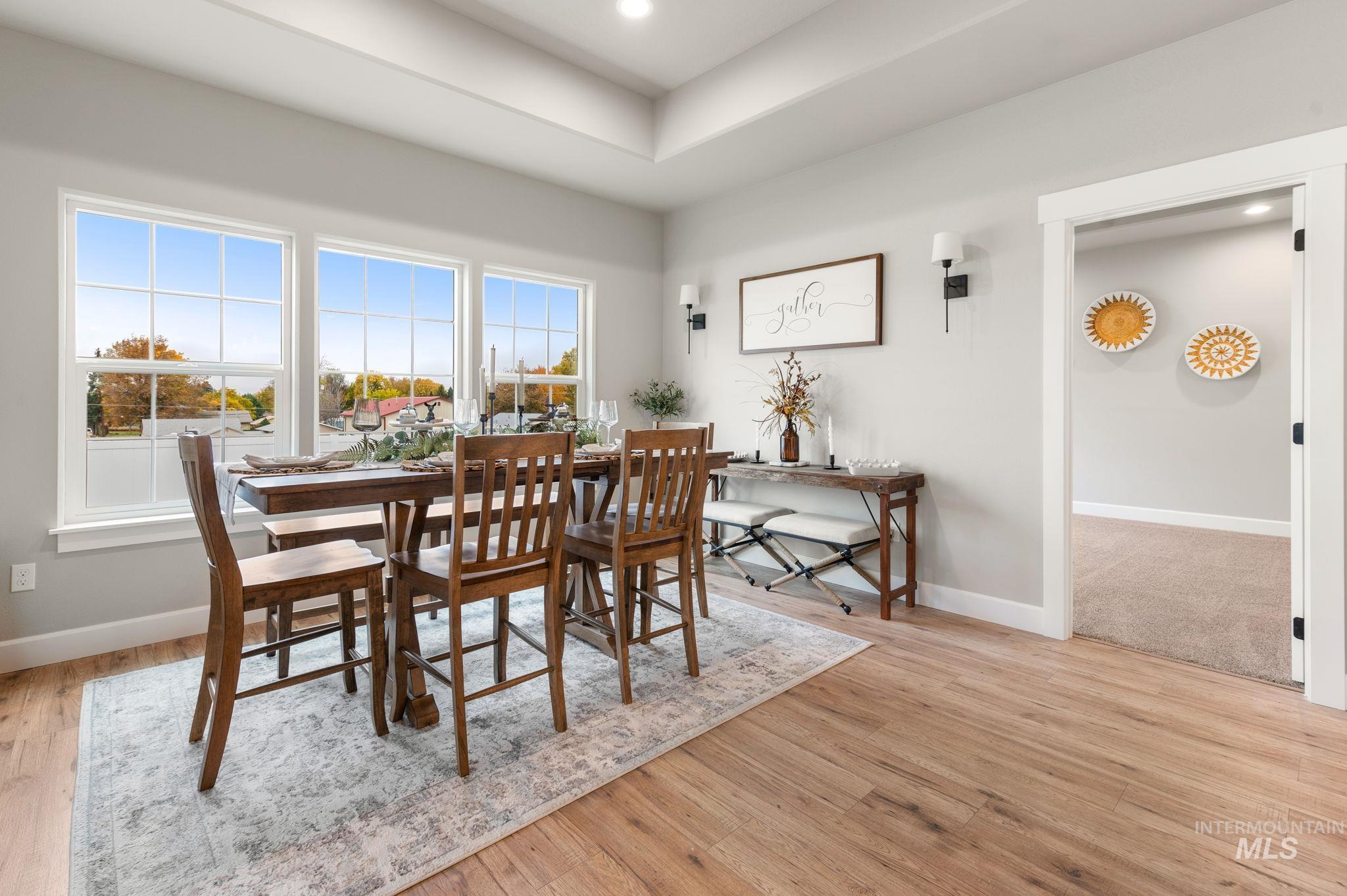 Dining space featuring light wood-style floors and recessed lighting