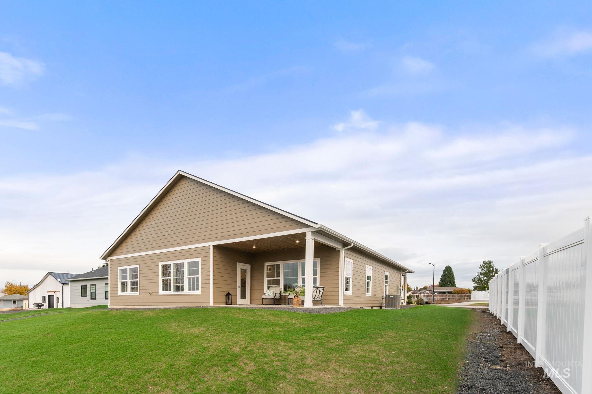 Rear view of property featuring a patio