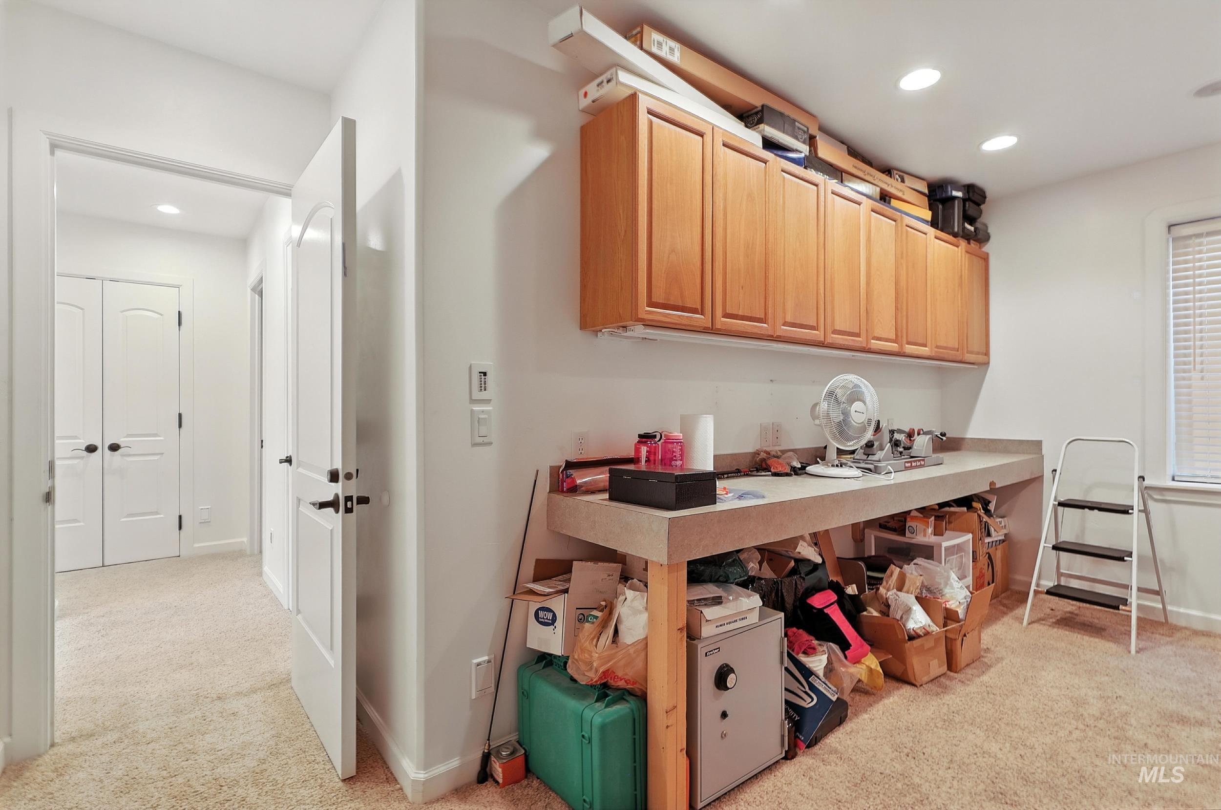 Kitchen featuring light carpet, recessed lighting, and light brown cabinetry