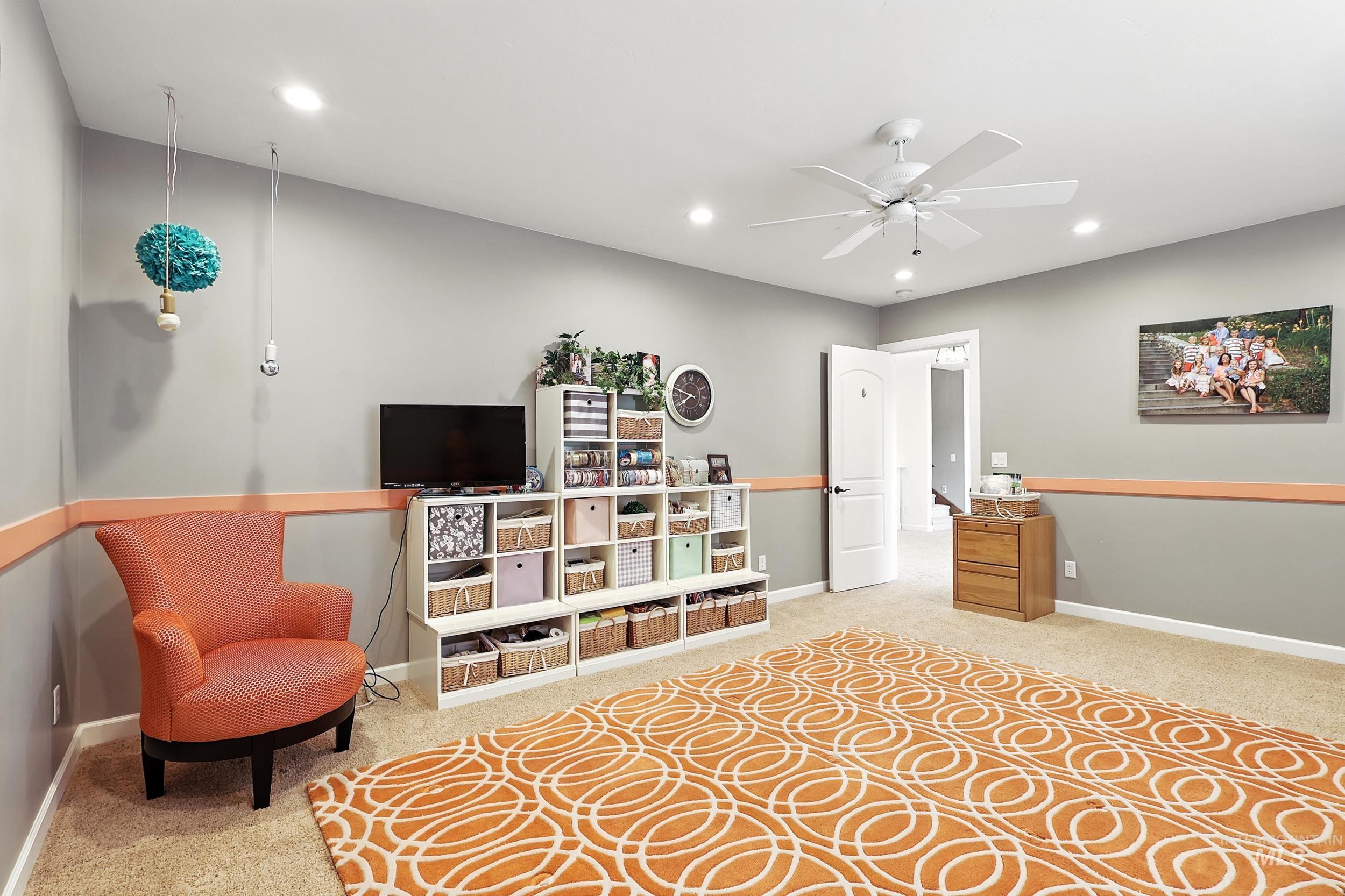 Sitting room featuring carpet flooring, recessed lighting, and a ceiling fan