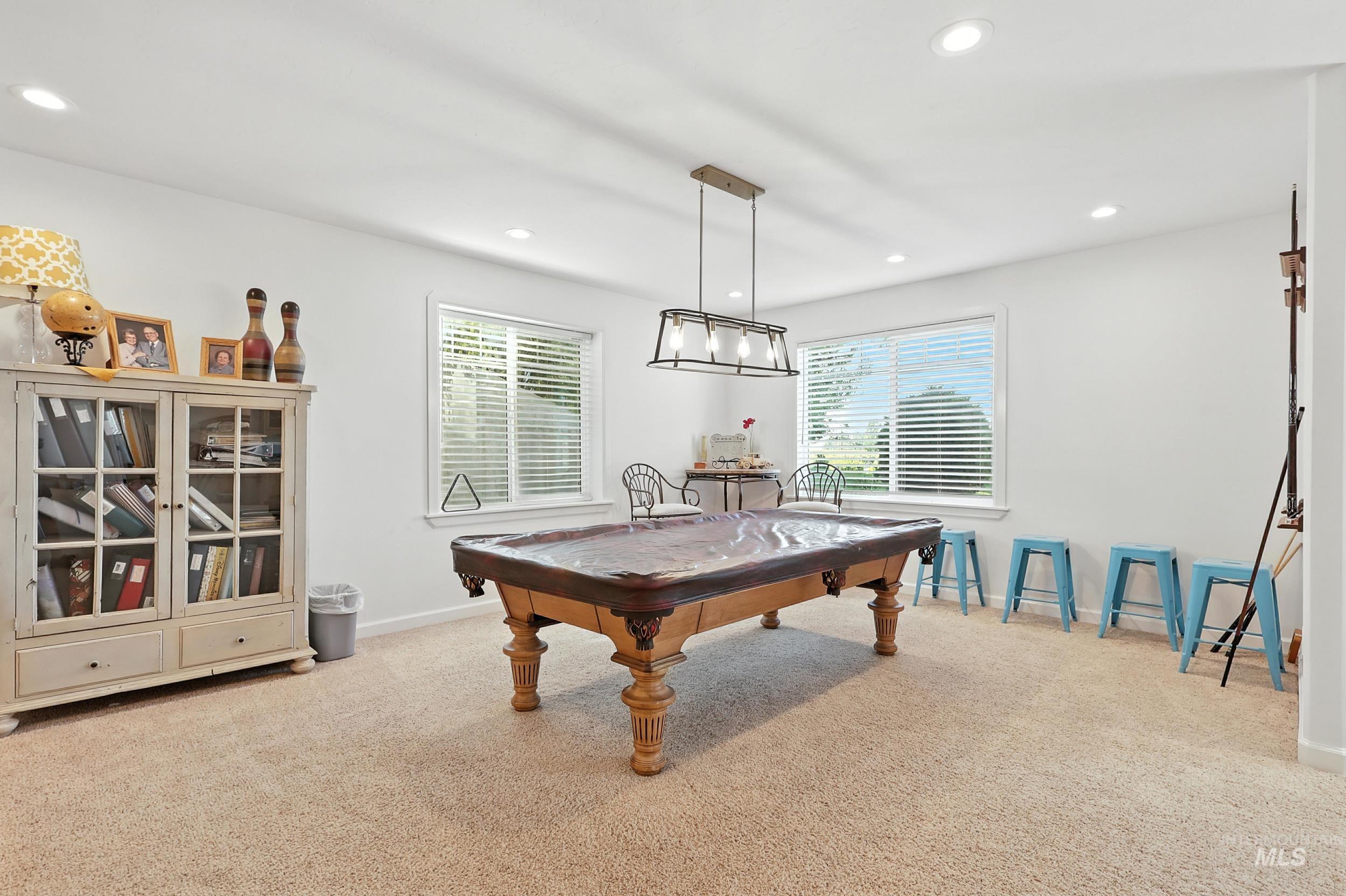 Recreation room with healthy amount of natural light, light colored carpet, recessed lighting, and billiards