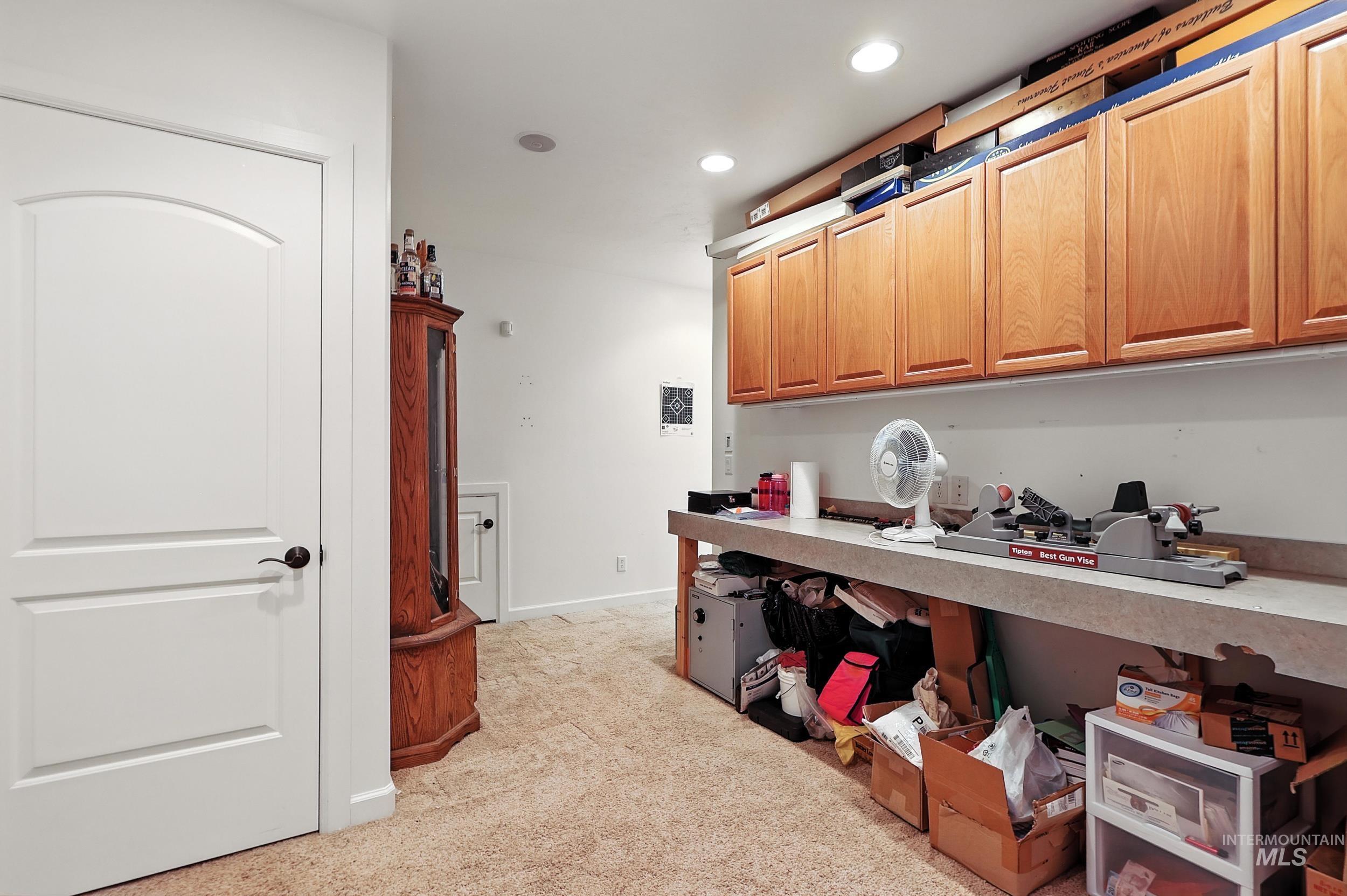 Kitchen featuring light colored carpet and recessed lighting