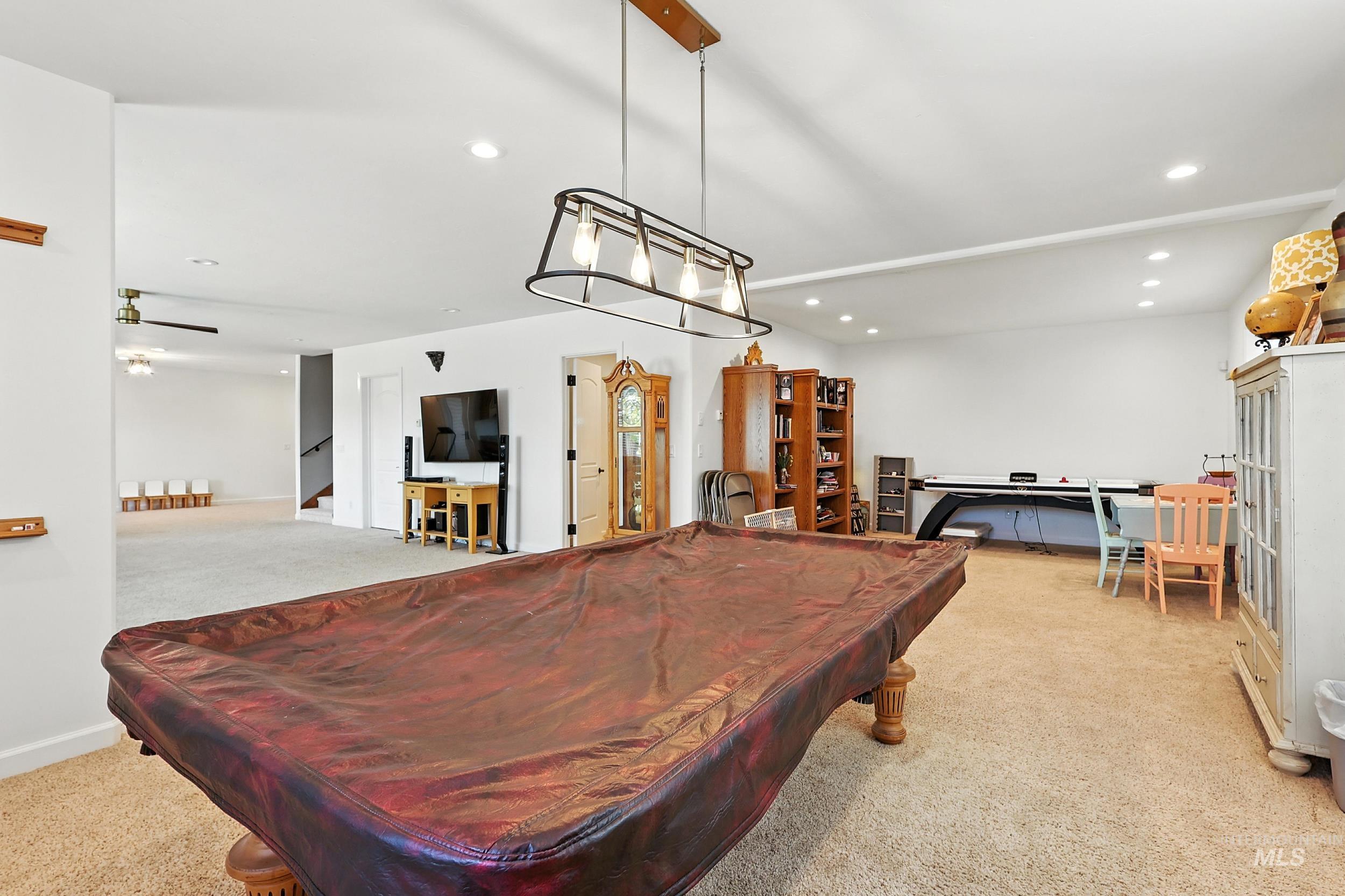 Recreation room featuring light colored carpet, billiards table, and recessed lighting