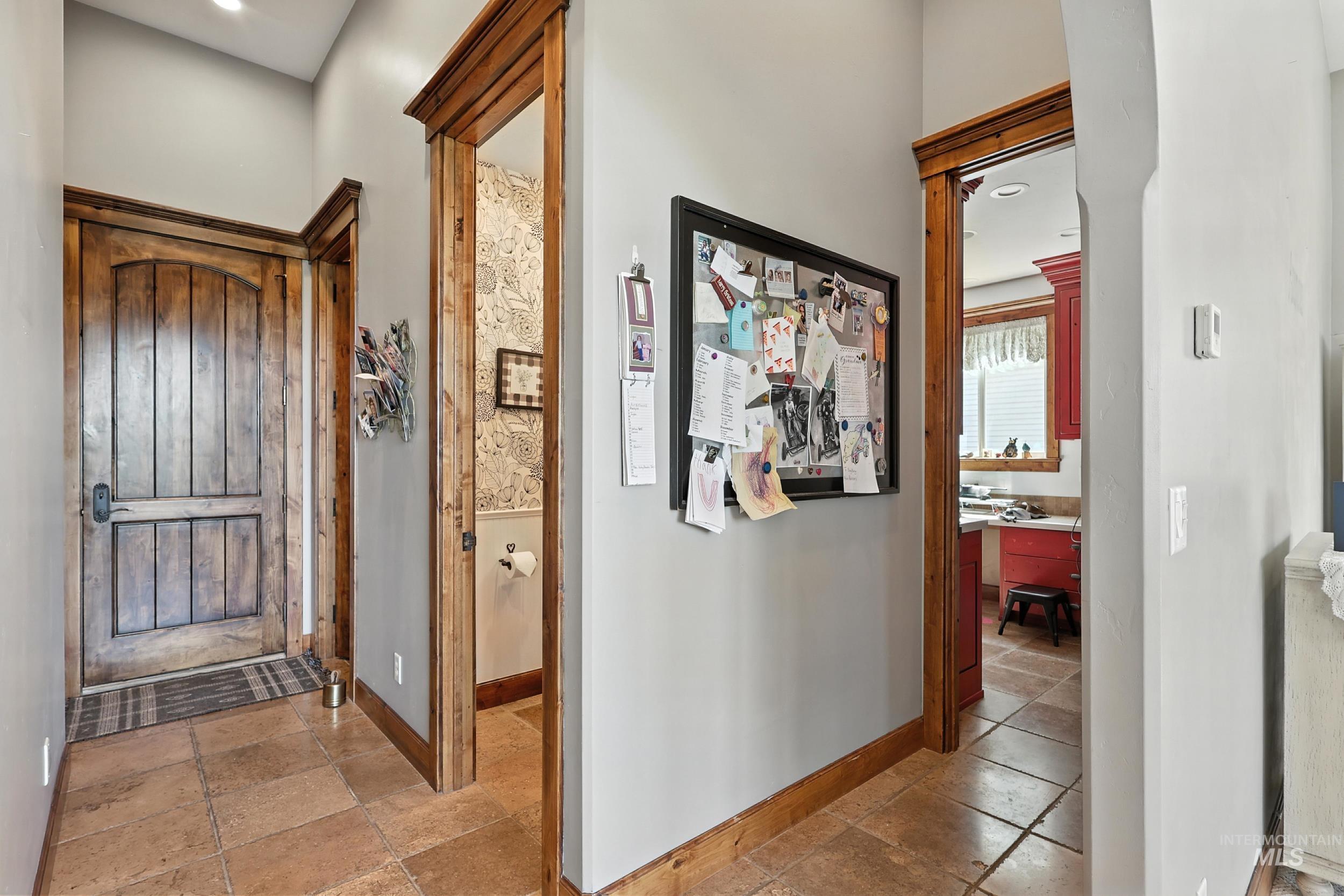 Foyer with recessed lighting and stone tile flooring