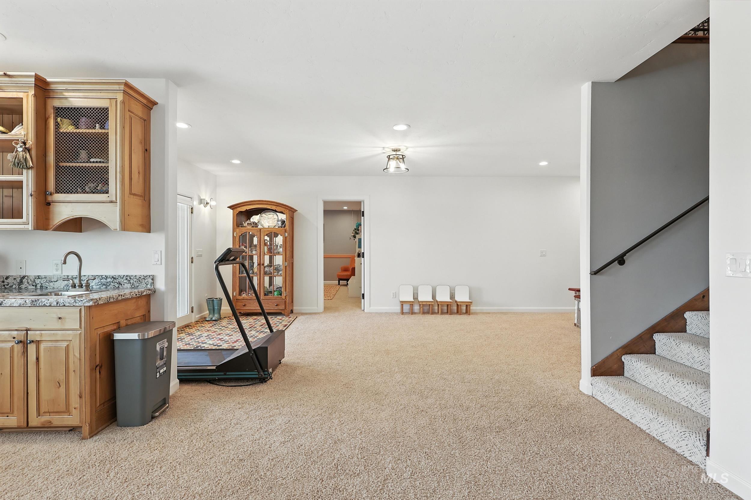 Game room with light carpet and recessed lighting