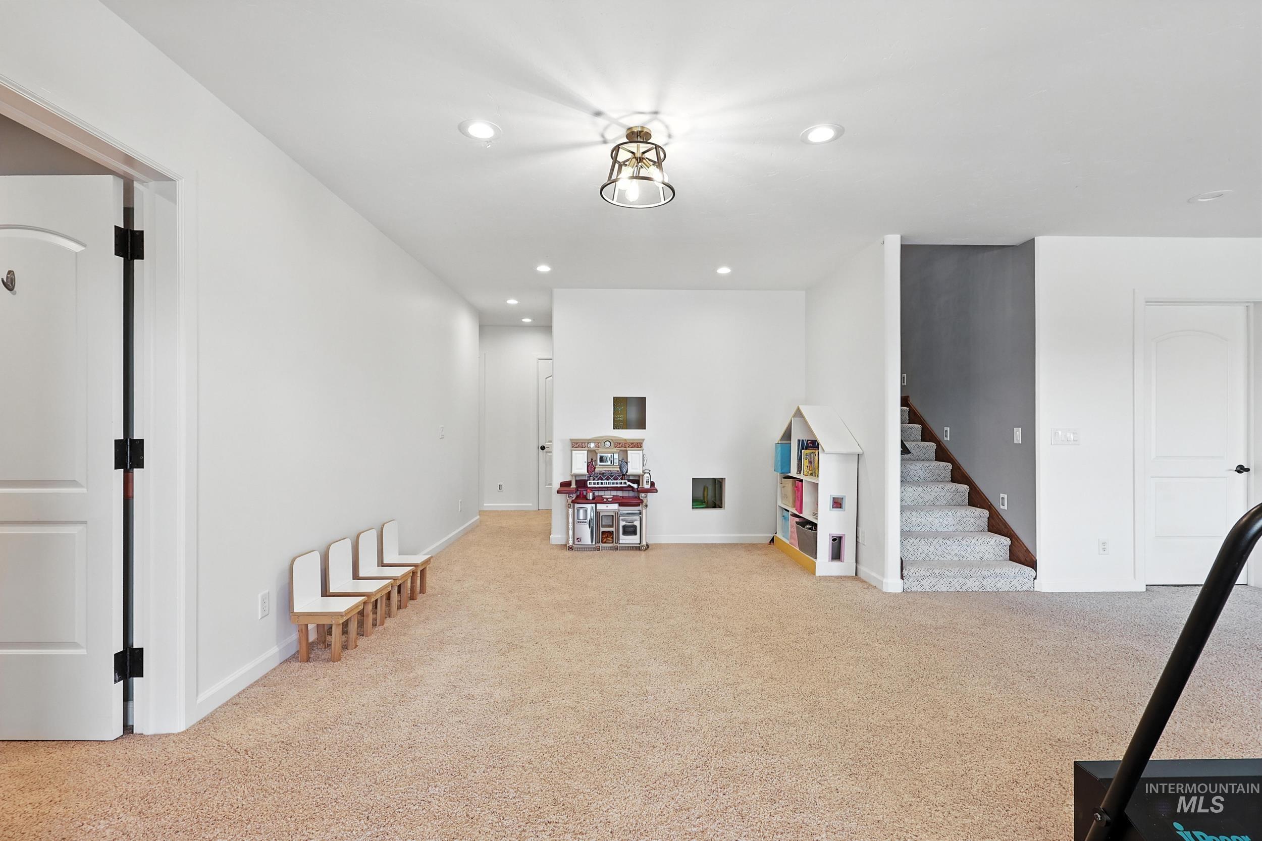 Recreation room featuring recessed lighting and light colored carpet