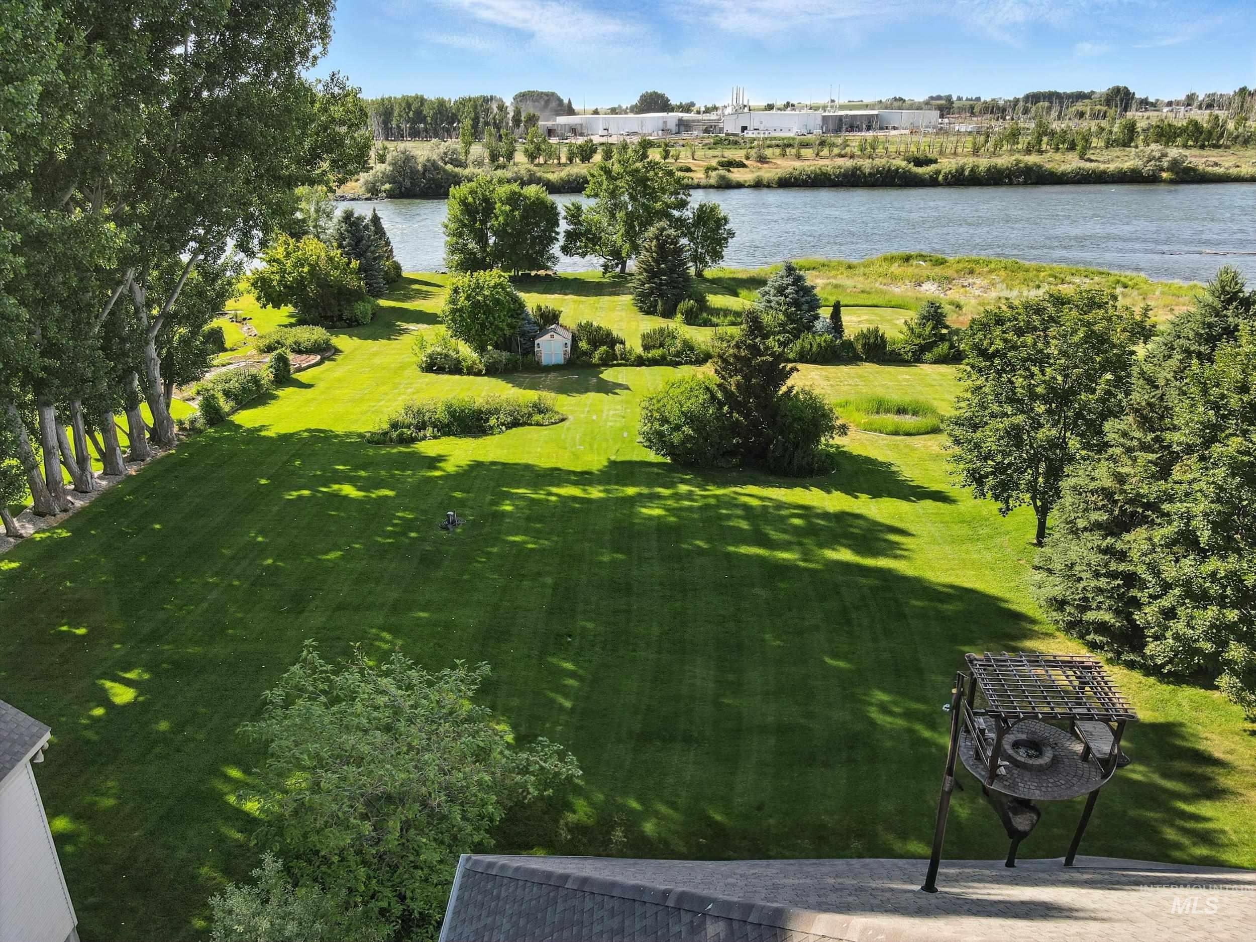 View of green lawn with a water view